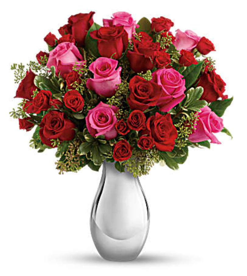 True Romance Bouquet with Red Rose - Turn up the heat on a new romance - or a lifelong love affair - with this premium rose bouquet. It features a total of fifteen of our finest red and hot pink roses and is accented with smaller red spray roses and luxuriant greens. It's all artfully arranged in our stunning Silver Reflections vase.