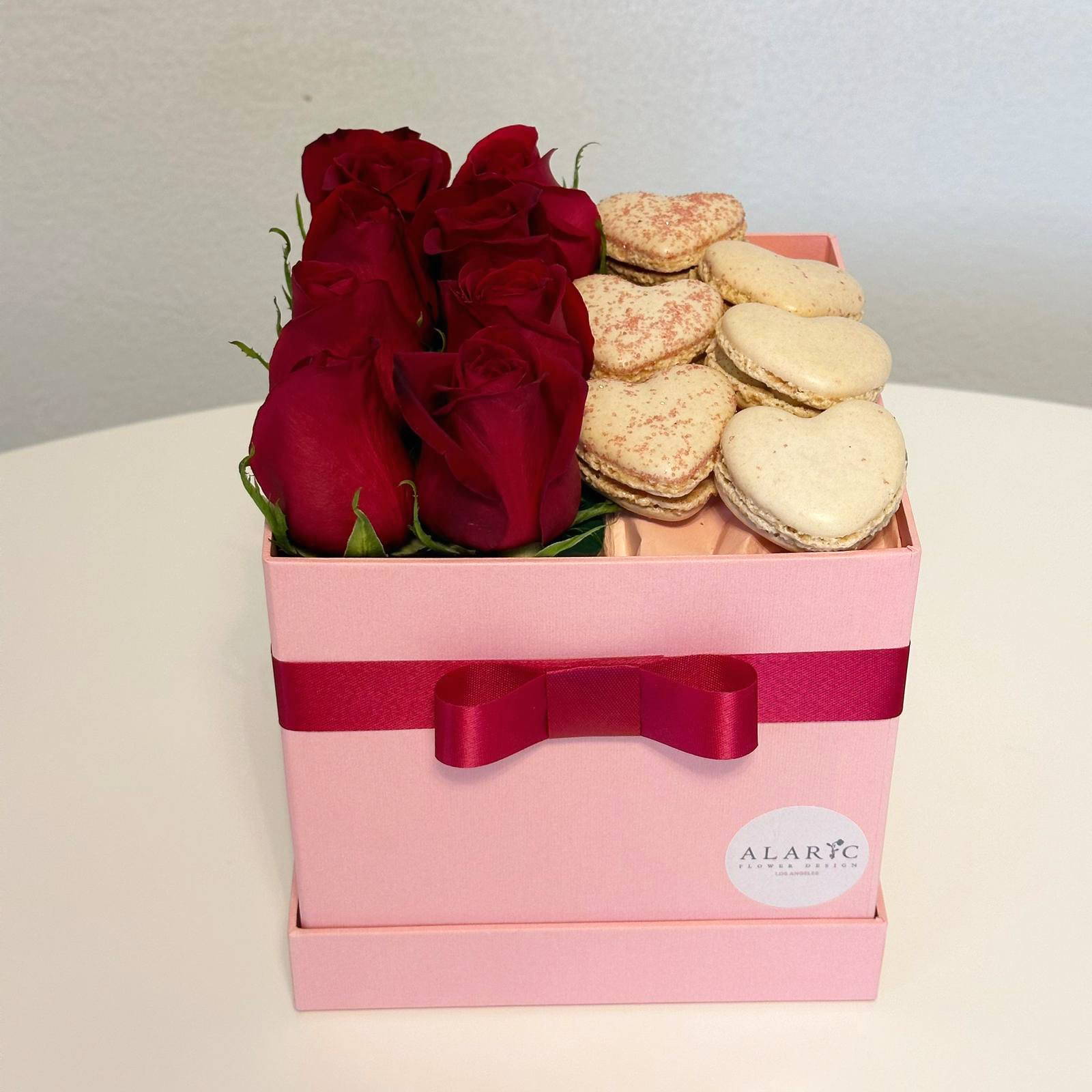 The Perfect Pair - Nothing says “I Love you” more than a big box of red roses and heart shaped macarons!  The small size box contains 8 red roses and half a dozen of heart-shaped macarons. The Big size box contains 15 red roses and a dozen of heart-shaped macarons.   Disclaimer: Varieties, shapes and colors of flowers and macarons may vary according to season and availability.