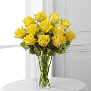  The FTD® Yellow Rose Bouquet  -  Sunny yellow roses are a cheery and wonderful gift. Celebrate a birthday, anniversary, graduation or any occasion with this lively bouquet arranged with seeded eucalyptus in a clear glass vase.    SKU#: E7-4808 