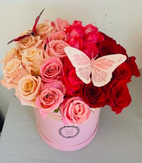 Butterfly Kisses - Product Information A beautiful cascading color whimsical arrangement. 30 fresh roses, in a 10 inches diameter and 10 inches height cylinder box, available in your color of choice or a combinations of colors, contact the designer by phone to confirm color availability. (Flower-Synergy 949-836-2542)