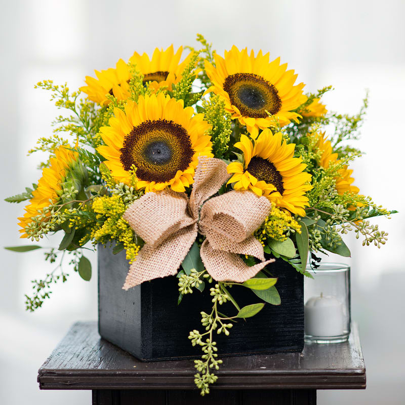 Box Full of Sunshine***** - Item Code: 110-VF The Box Full of Sunshine consists of fresh sunflowers in a wooden box.  The country look is completed with solidaster filler, seeded eucalyptus, and burlap ribbon.   approx. 13&quot;h x 7&quot;w