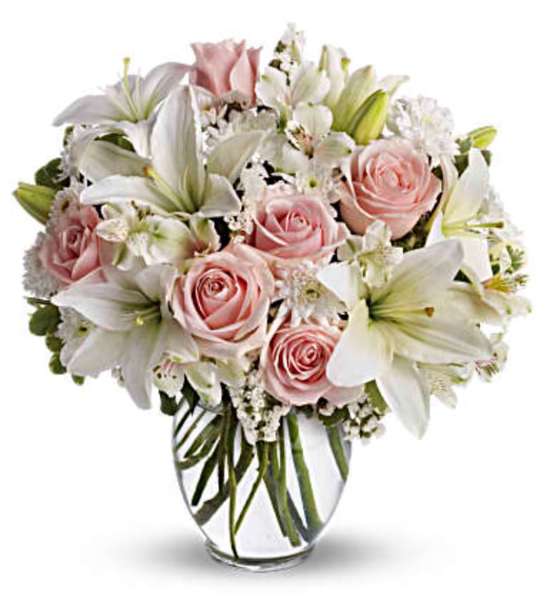 Arrive In Style - Express your love with the eloquence of Shakespeare - without saying a word. She'll adore this exquisite bouquet of roses and lilies and other pastel favorites in a classic ginger vase. And she'll know just the words to let you know.