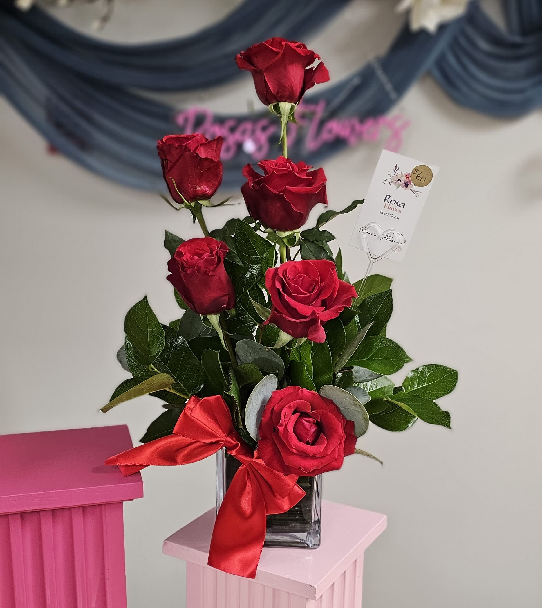 Be Mine Be Mine - A beautiful arrangement of six roses with greenery in a glass cube vase tied with a red bow