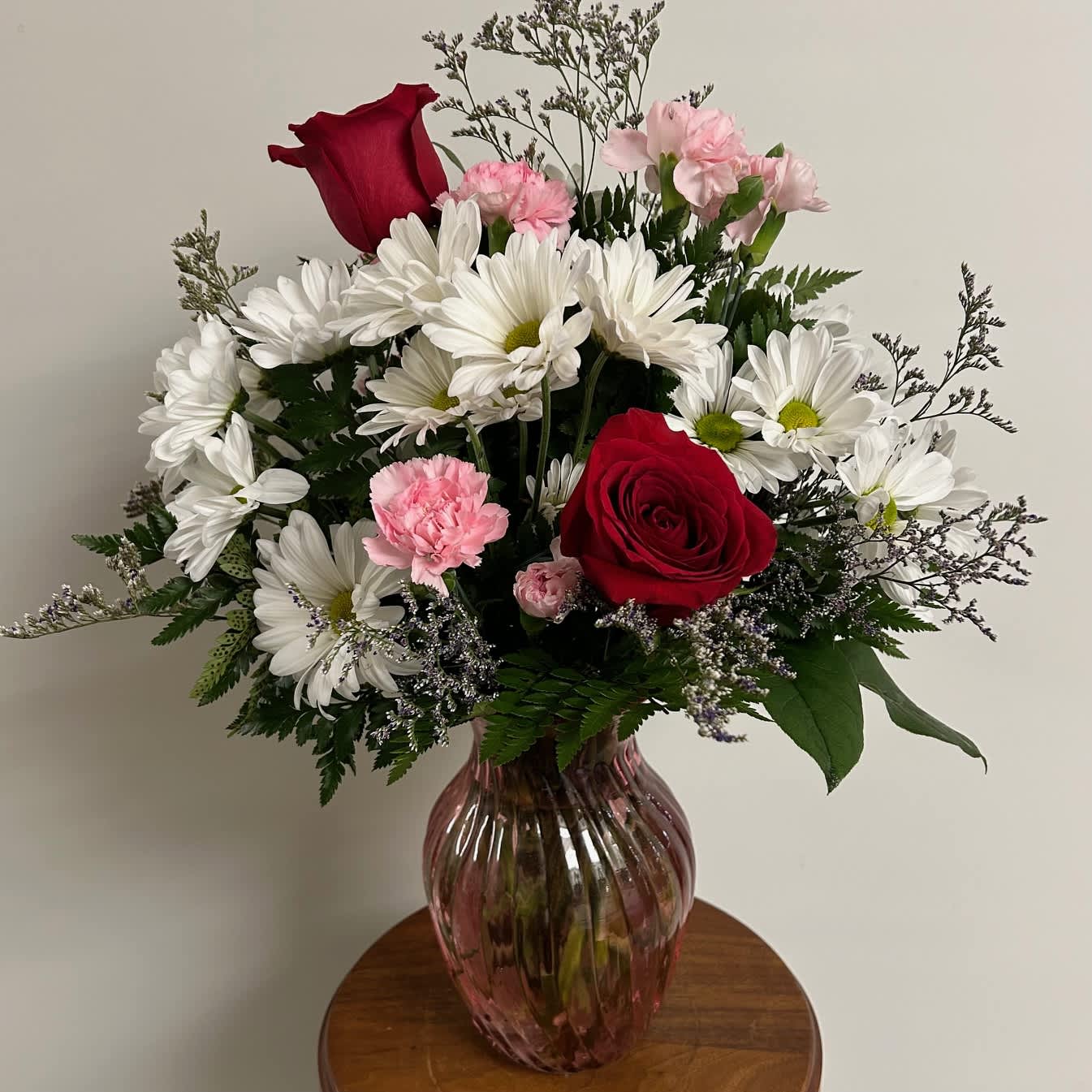 Boldly Bashful - Boldly Bashful is a great gift for Valentine's Day or Birthday.  This all-around arrangement Includes 3 RED ROSES and flowers such as white daisies, carnations. Vase color may vary! 