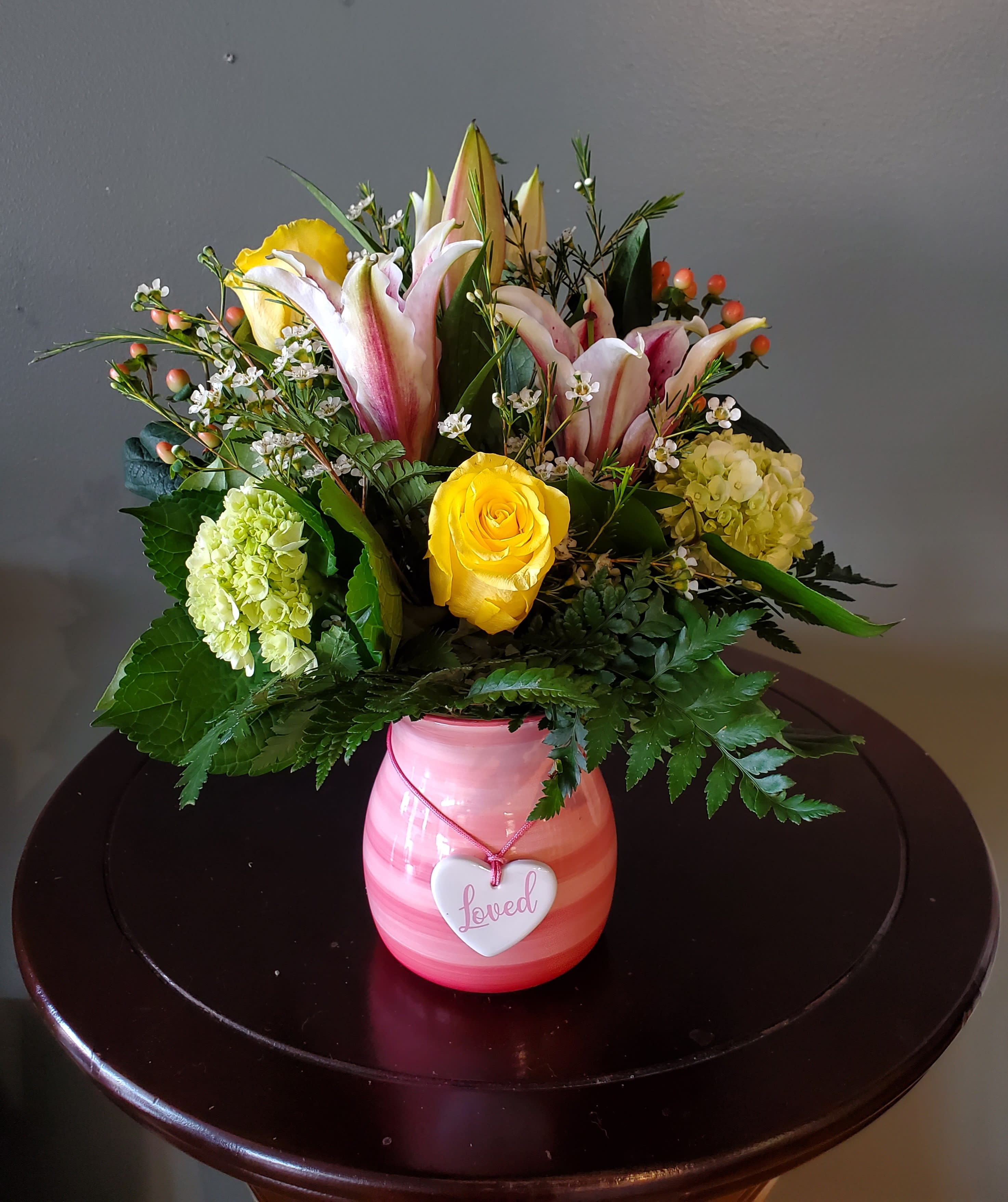 You Are Loved - Capture the sentiment of her love with our loved vase, filled with bright and colorful spring booms. It come with a unique variety of blooms in pink, green, white and yellow. It’s a simple yet stunning way to remind her how much she means to you. Flowers may differ then pictured due to product availability. 