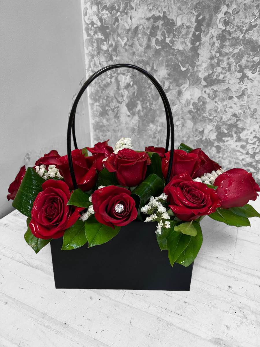 Lady of Love - What an awesome way to express your love to the &quot;Love of your Life&quot; with our Lady of Love bouquet, design in a black purse holder and a dozen of red roses. 