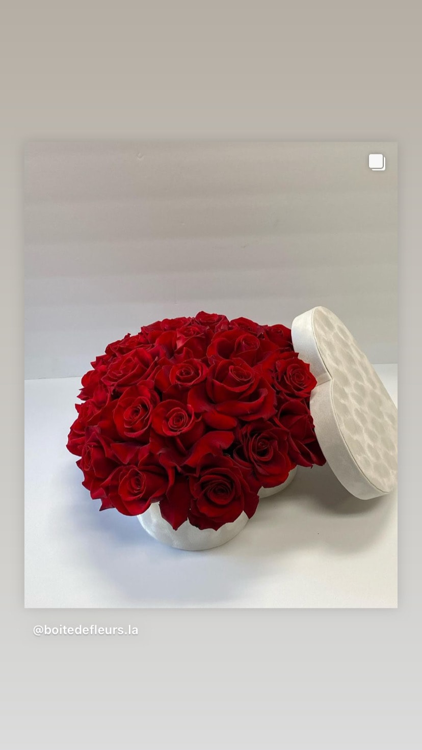 Red in White - Red premium roses in a white heart box.
