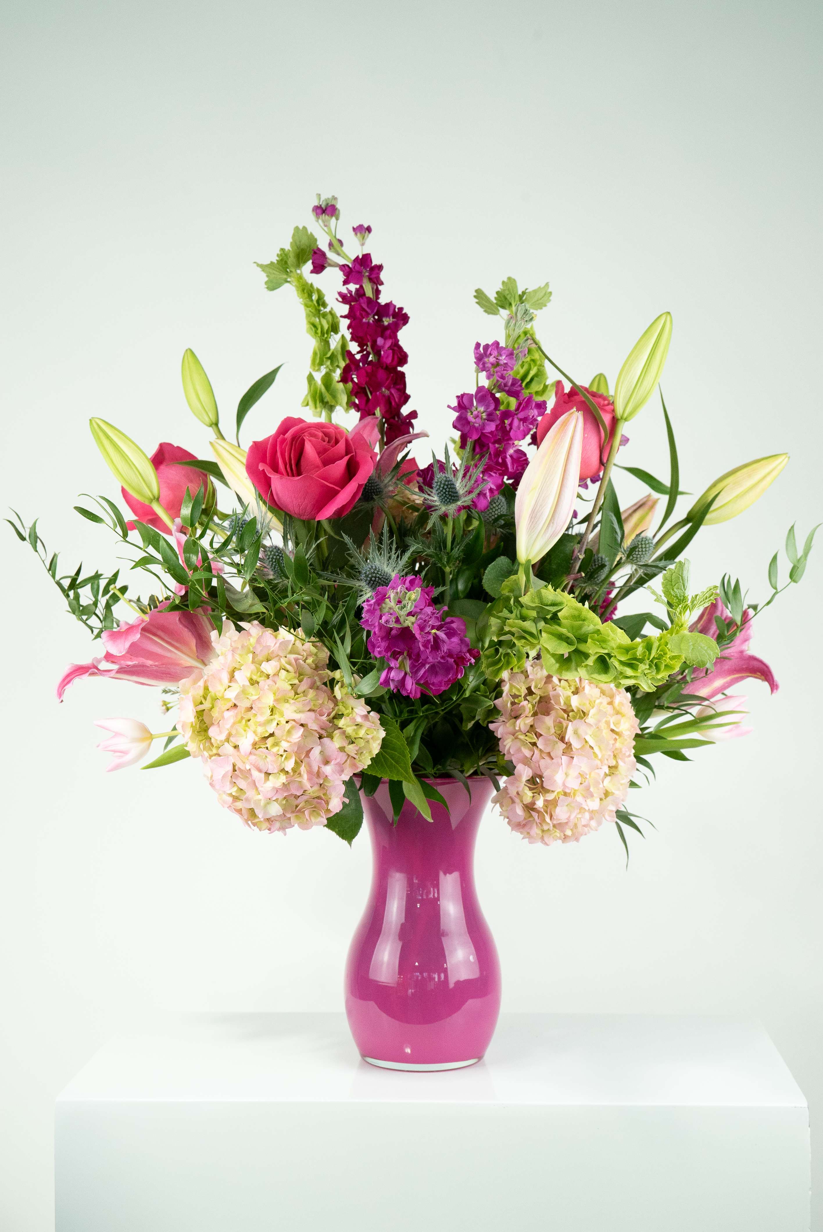 The Power of Love's  - This grand arrangement will do the talking for you. An expression of love, it comes with a healthy array of hydrangea, roses, bells of ireland, stock, lilies, and thistle. 