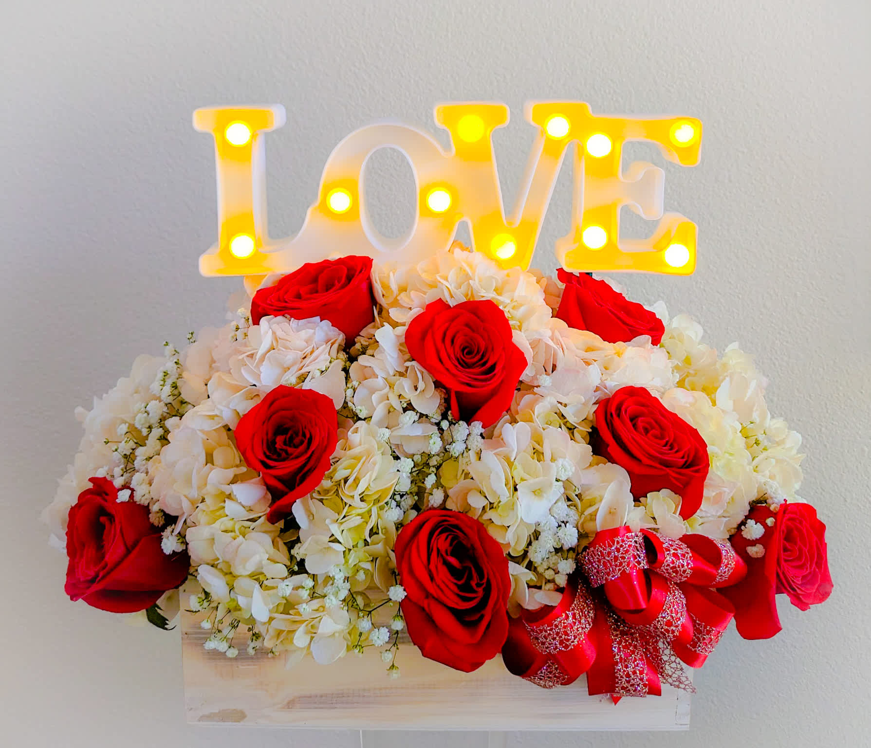 Love Sign - 12&quot; rectangular wood box filled with red roses, pink hydrangeas, and baby's breath, and accented with a unique LED love sign.