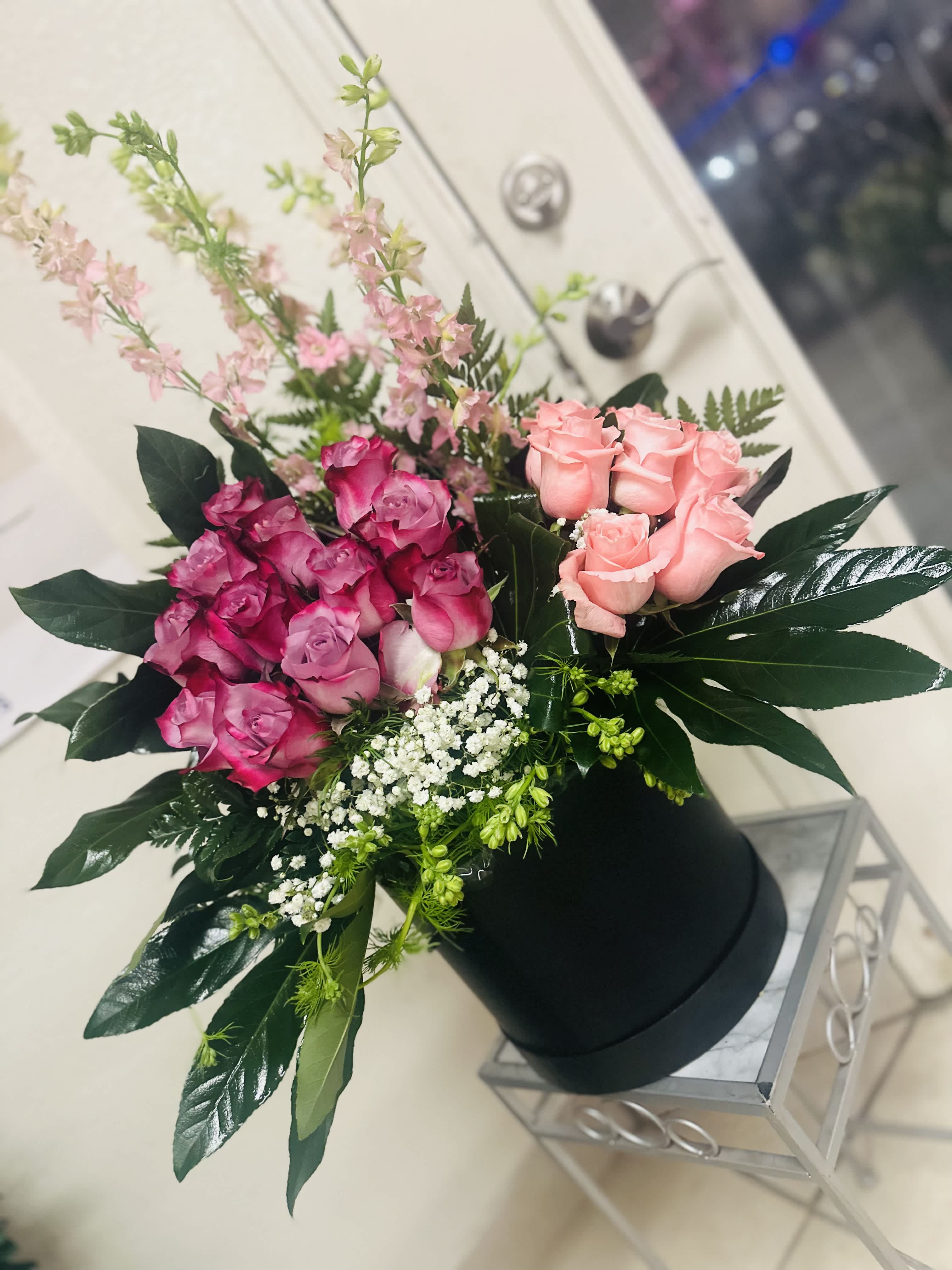Elegant bouquet  - A unique arrange of different light colors in a cylinder box that brings out the elegance of a unique arrangement. 