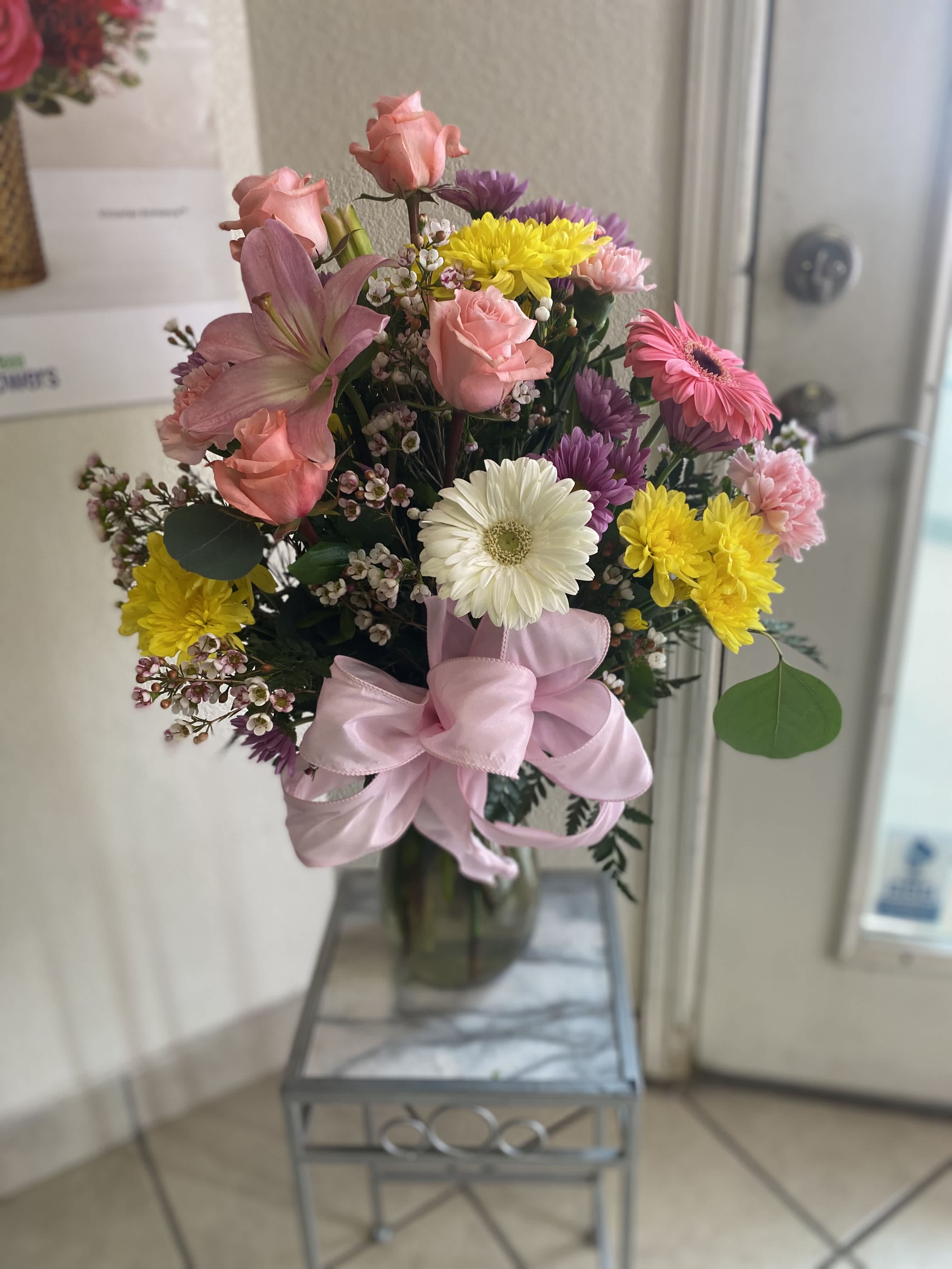 Beauty and Grace Beauty and Grace - An arrangement featuring a beautiful mixed of florals guaranteed to satisfy that special someone