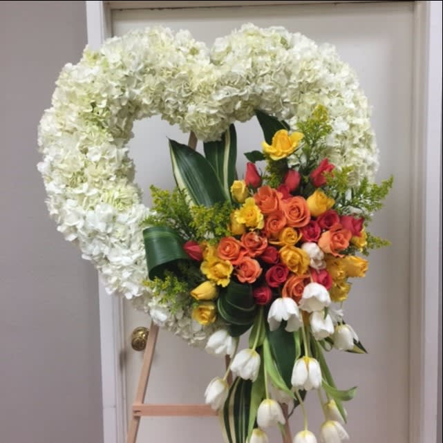 Funeral 8 Funeral 8 - White hydrangea heart shape on stand with arrangement on one side. Arrangement can be in any color combination.