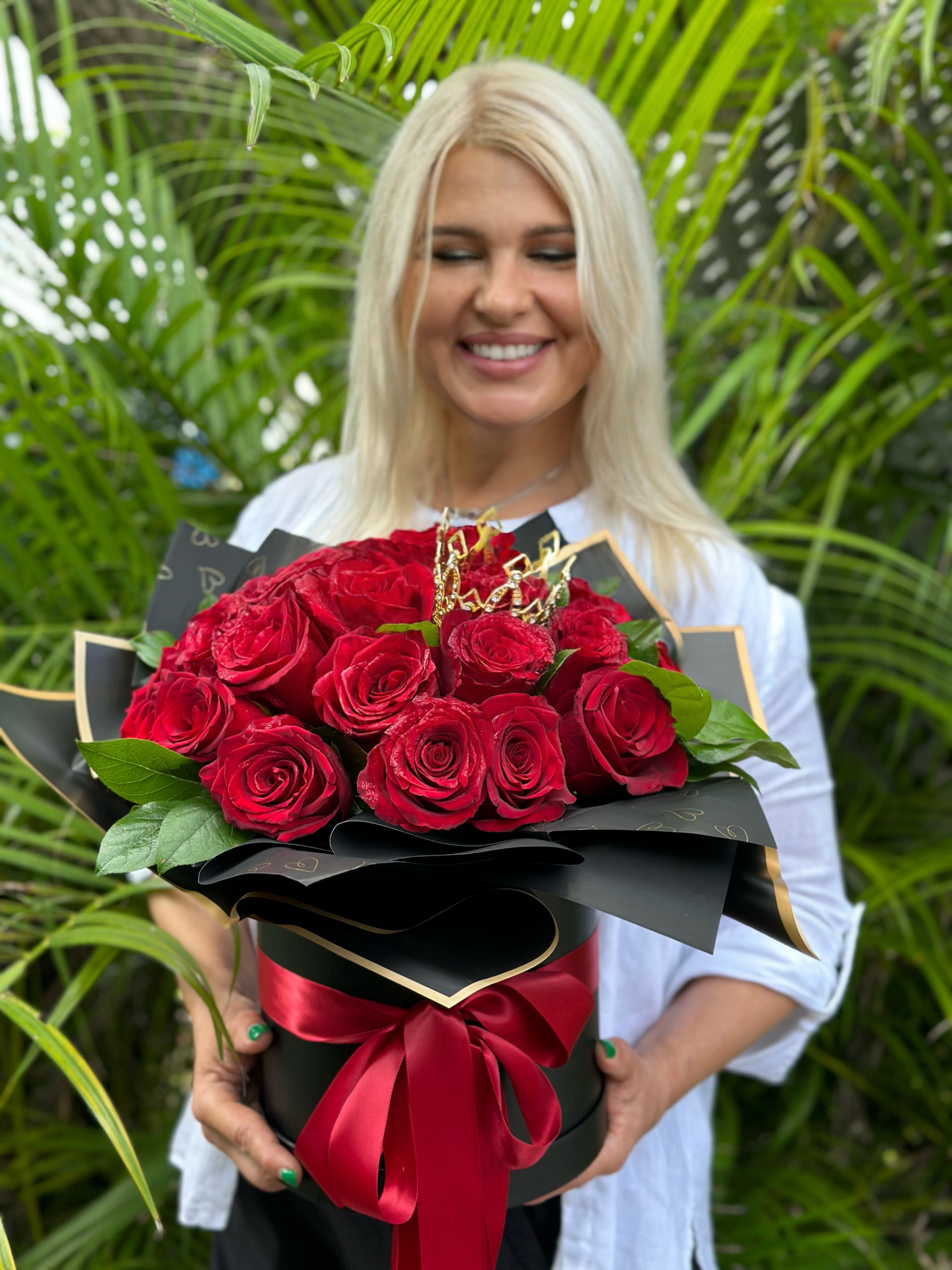 Queen of roses - Amazing arrangement of red roses with crown on top in a box and paper.  available in a black or white box