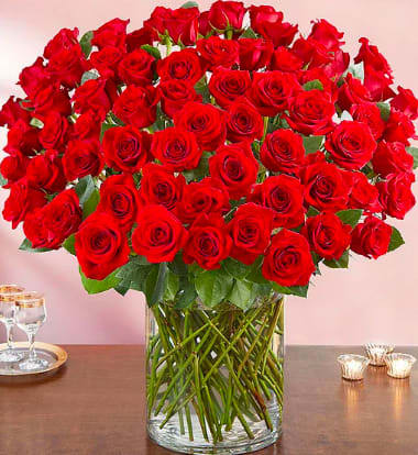 Century Roses - Wow the one you love like never before with 100 stunning long stem red roses! Our spectacular arrangement is artistically designed by our expert floral artisans with an abundant array of dazzling red blooms and lush greenery inside a classic cylinder vase. Standing over 2 feet tall, this luxurious surprise is personally hand-delivered for a grand romantic gesture she’ll remember always.
