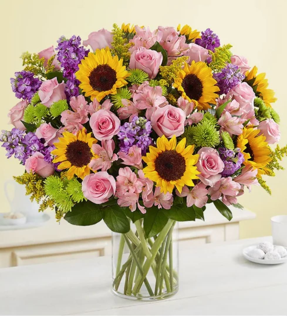 Pixie - Designed to be as unforgettable as the person who receives it. Our luxurious arrangement of colorful, fresh-from-the-garden blooms is artistically arranged inside a chic cylinder vase by our expert florists to create the ultimate wow gift for someone who means the world to you.