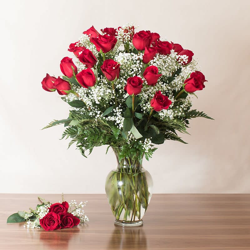 2 DOZEN PLUS 3 PREMIUM ROSES (as seen includes small 3 rose separately in cello 27 total) - 27 red roses  A beautifully arranged masterpiece of two dozen premium red roses with accent fillers in a glass vase. For when one dozen is just not good enough!  (as seen includes small 3 rose cello)