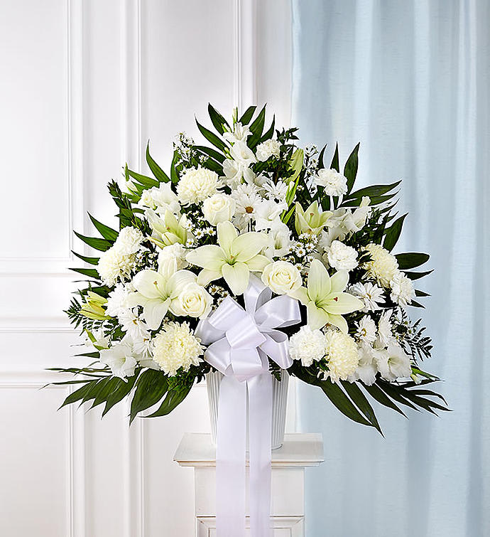 HEARTFELT SYMPATHIES ALL WHITE HEARTFELT SYMPATHIES ALL WHITE - Symbolizing peace, serenity and purity, white flowers can help comfort those grieving the loss of someone they loved dearly. Our majestic standing basket arrangement in angelic white is an impressive tribute to their memory.