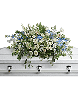 Tender Remembrance Casket Spray  - As soft and delicate as a tender remembrance, this stunning spray of sky blue hydrangea and pure white roses brings a fresh, natural beauty to the casket.