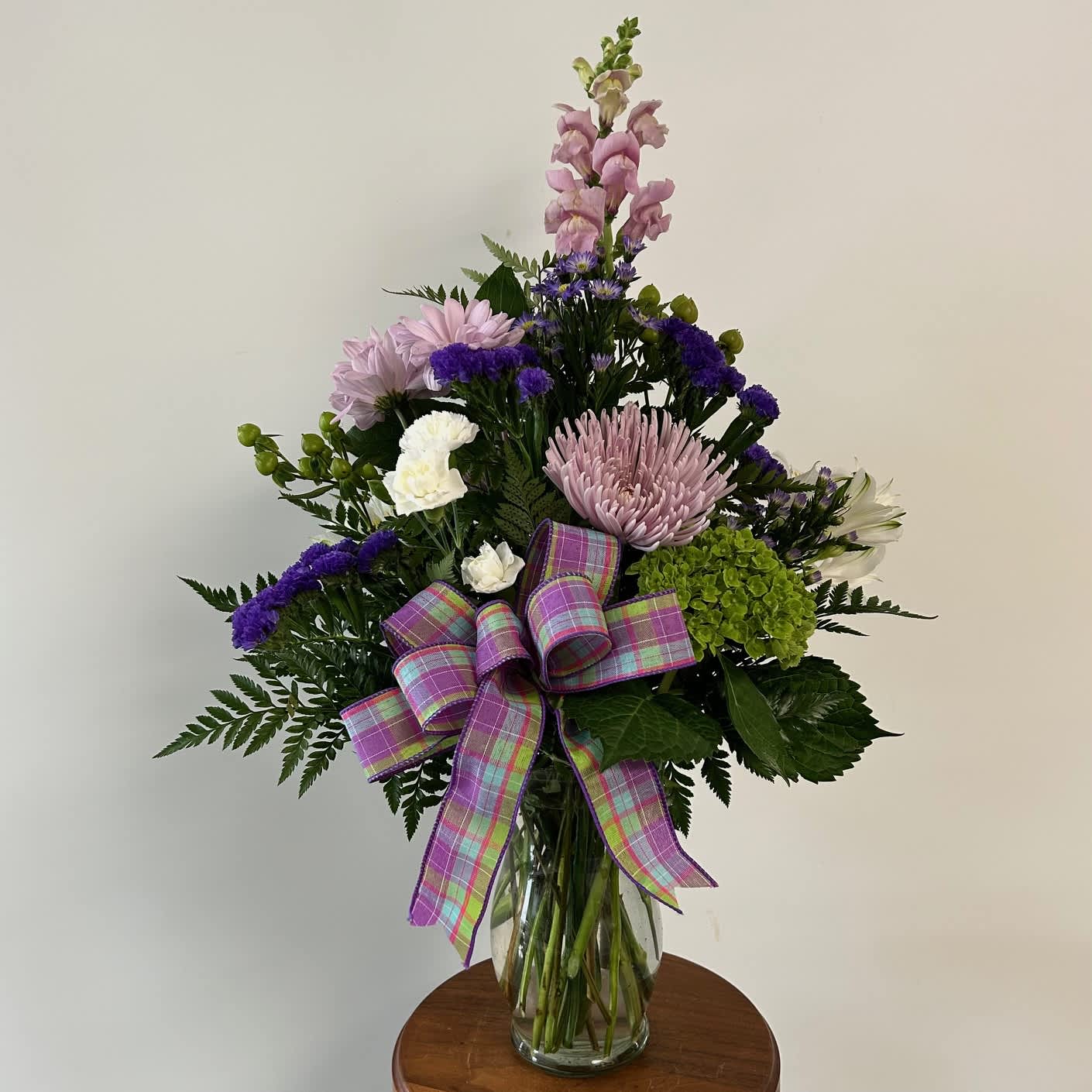  Spring Romance Bouquet - Purples, whites and greens in a clear vase with bow. 