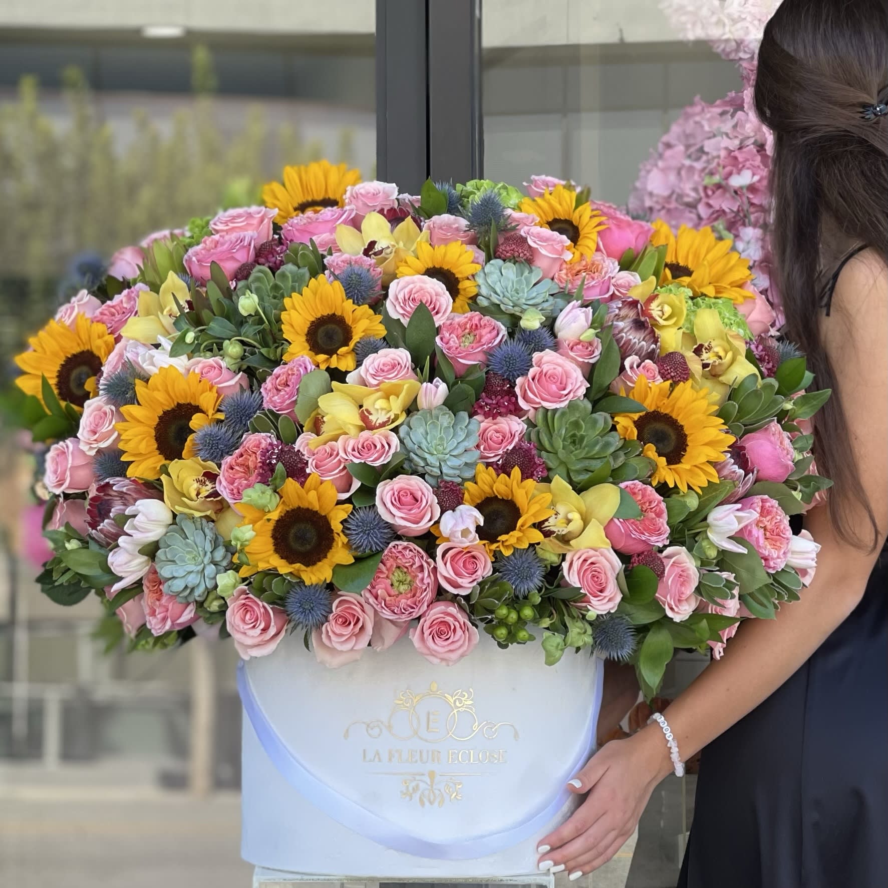 Sunny Field V - Mix of flowers in our black velvet signature box.                                                                                Standard – pictured  Deluxe – the amount of flower will be bigger. We will also put more premium flowers into the arrangement. Premium – put more premium flowers       