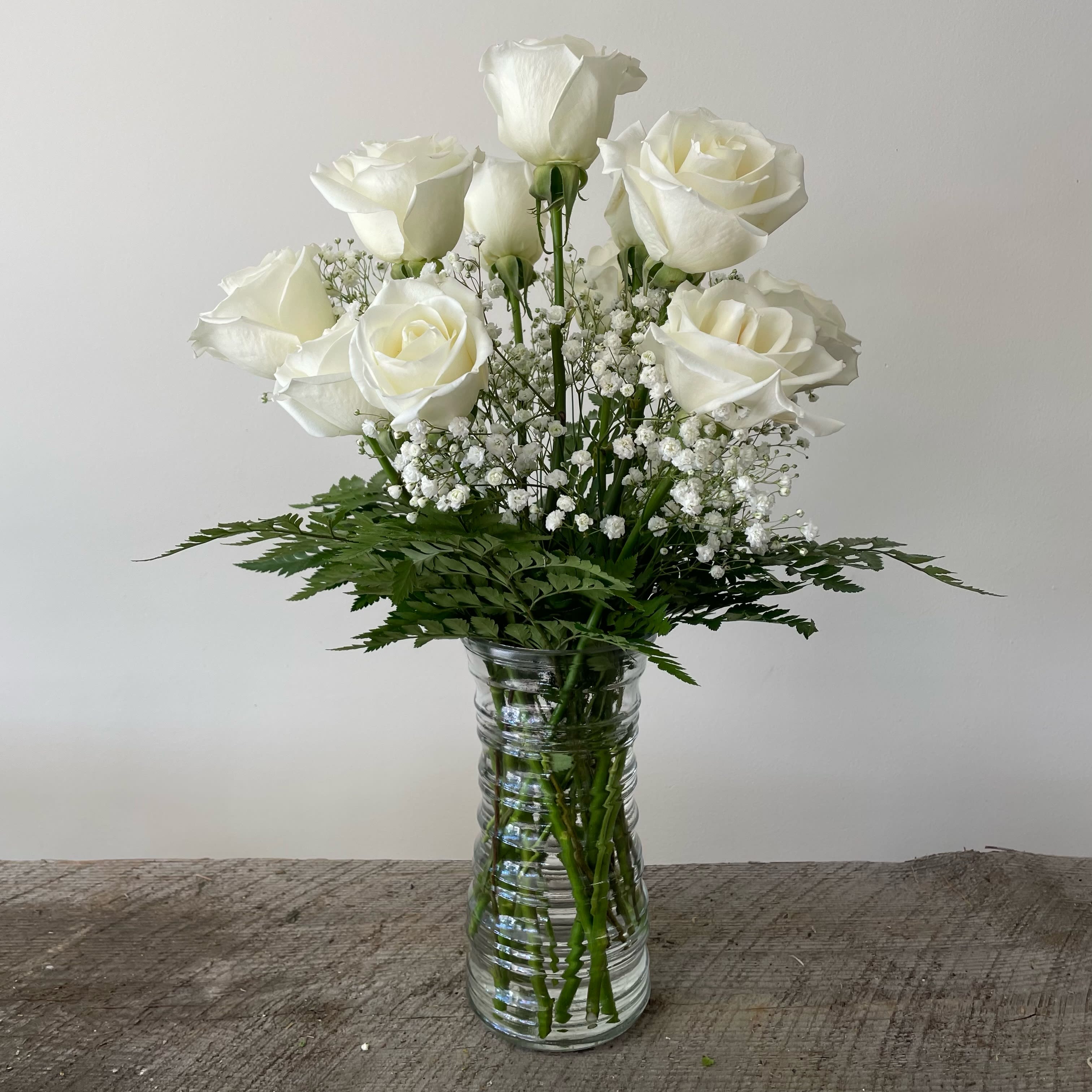 Dozen White Roses - White roses represent purity, innocence, and honor. Deluxe: 16 roses Premium: 20 roses