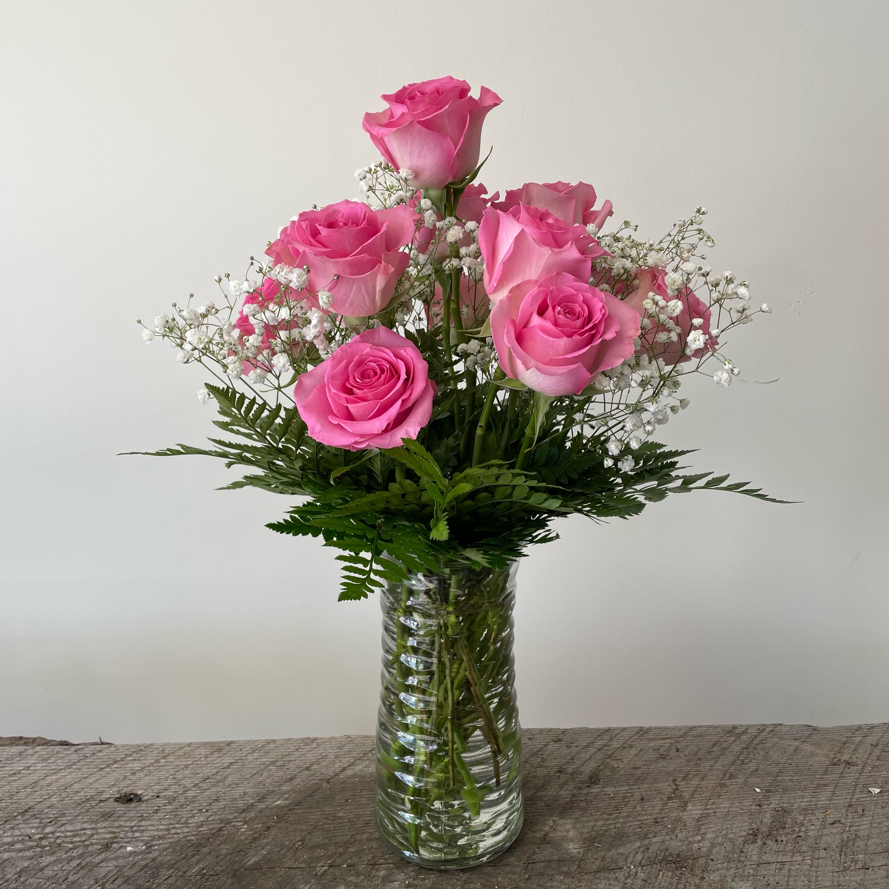 Dozen Pink Roses - Pink roses represent gratitude, appreciation, and admiration.  Deluxe: 16 roses Premium: 20 roses