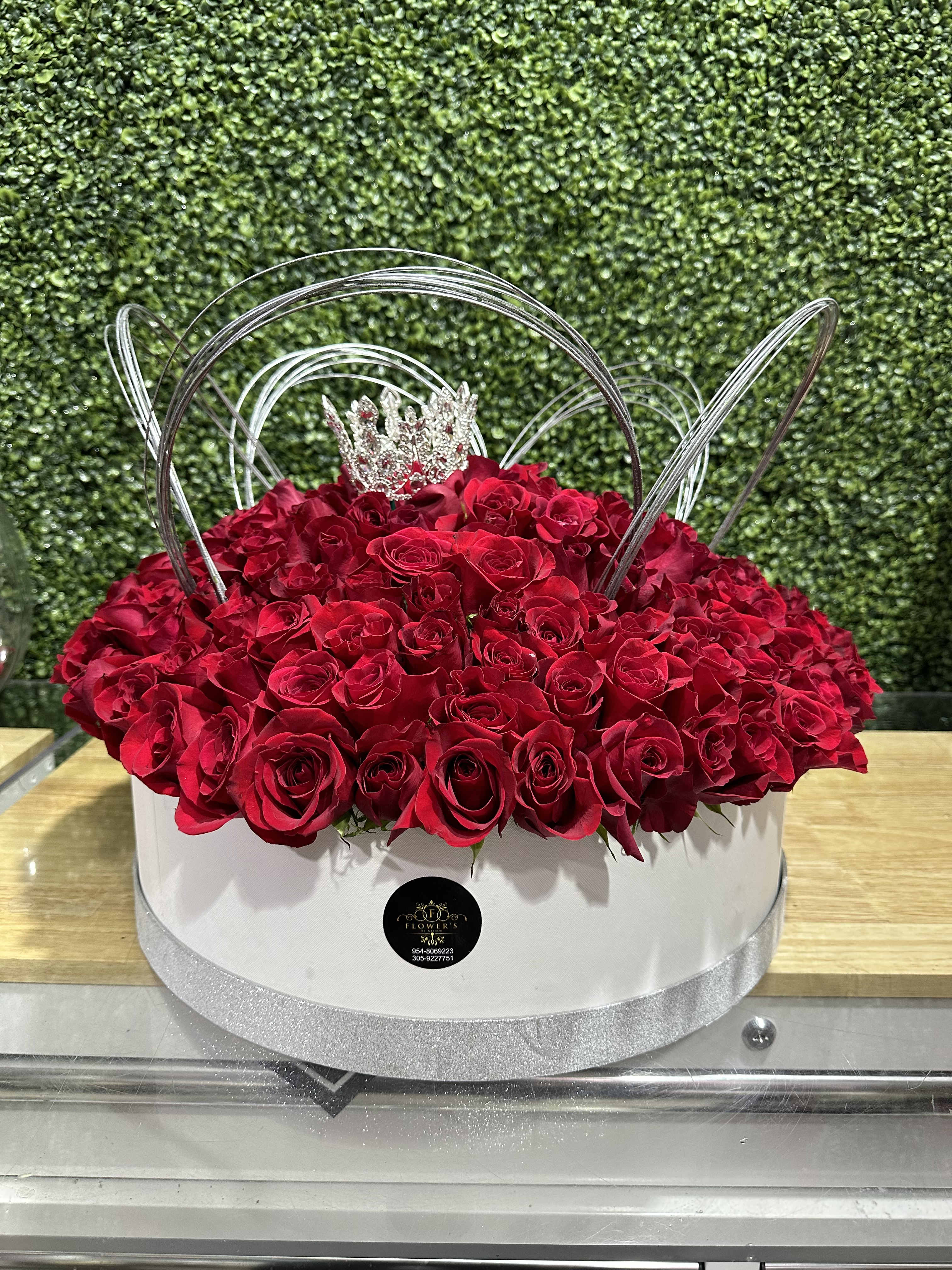 the queen the queen - arrangement of red roses in a round box with a crown