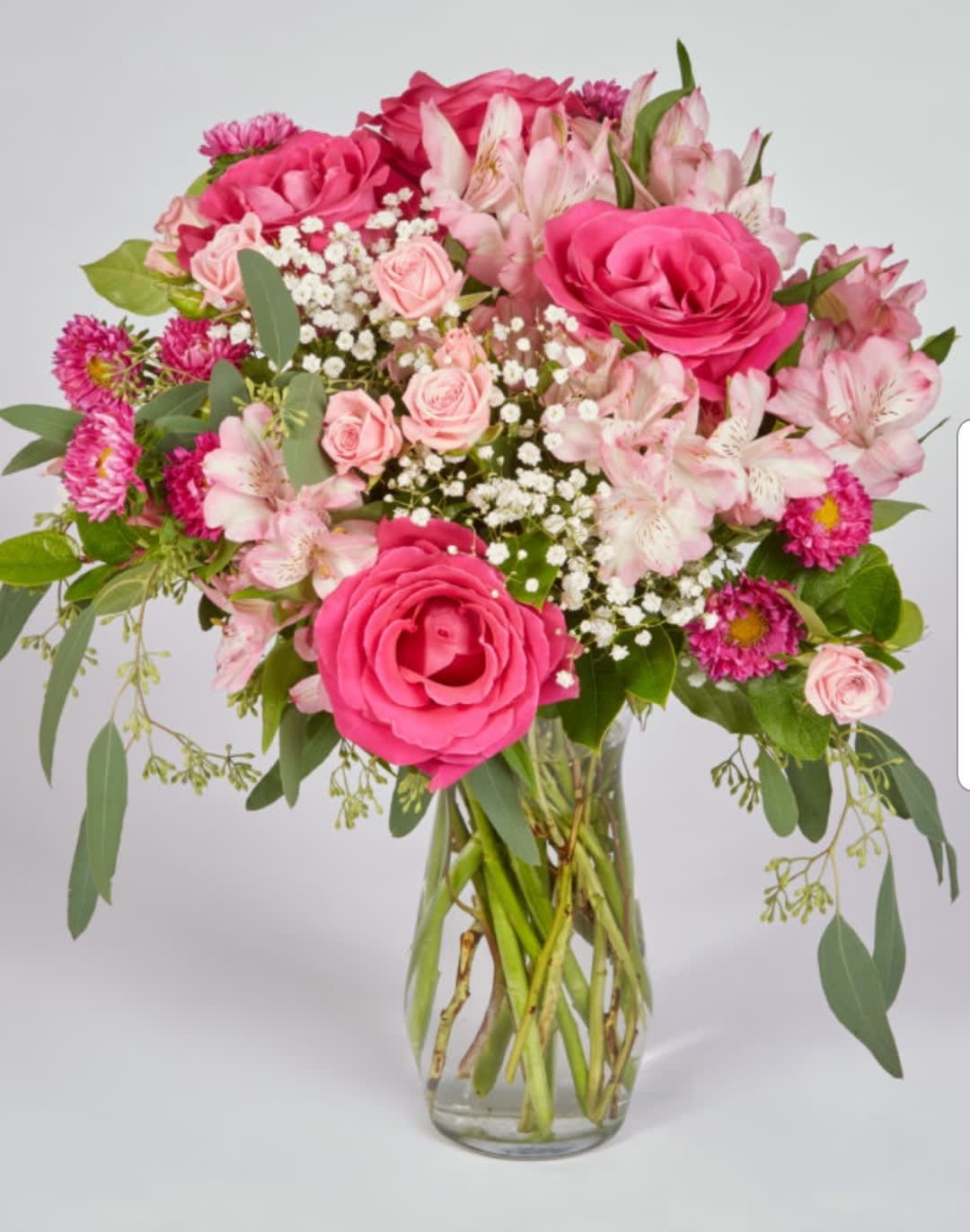 Positively Pink - This fun, flirty arrangement is just the right gift for that special friend or special love. With roses, spray roses, alstro and asters designed in different shades of pinks. 