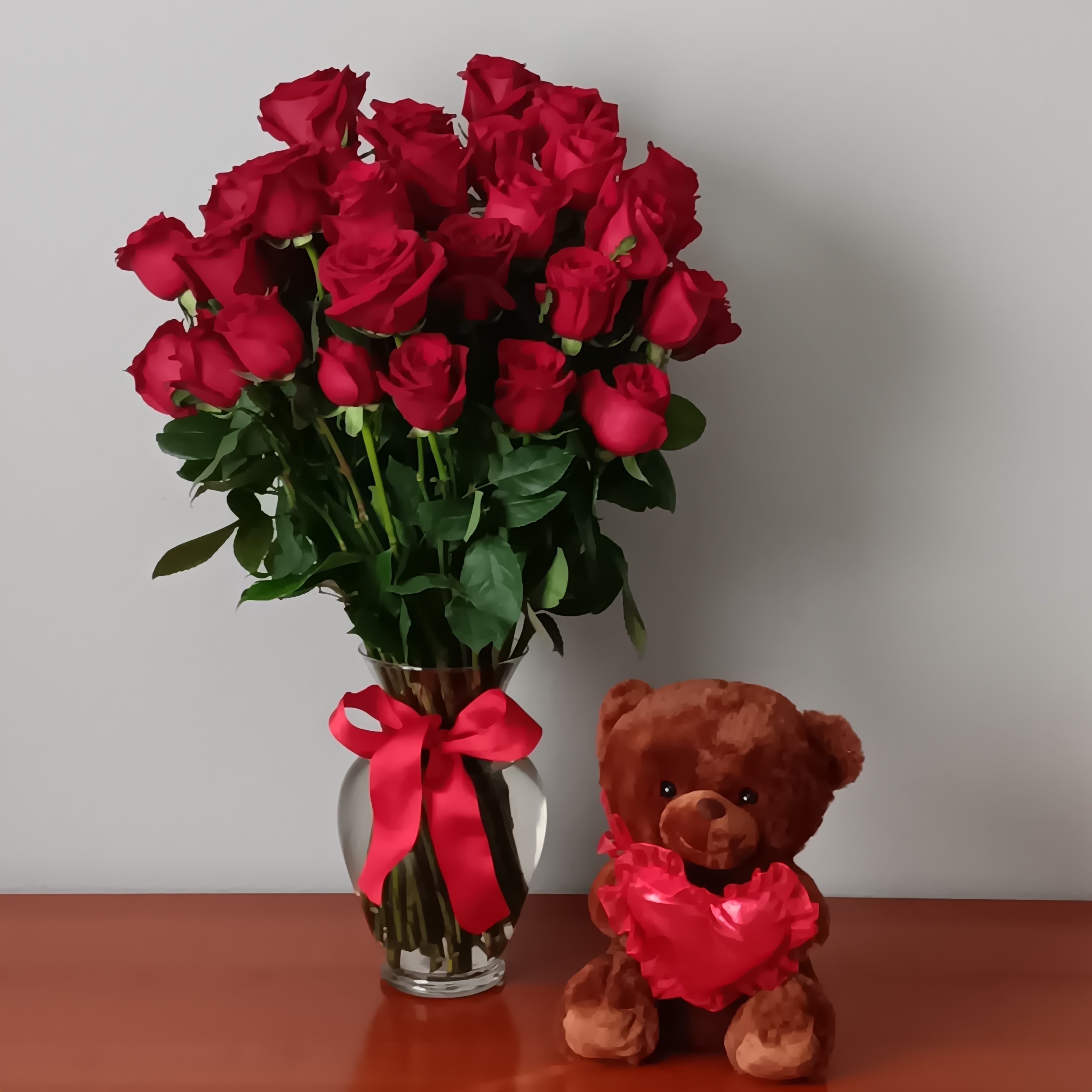 Always on My Mind - 48 Long Stemmed Red Roses with Medium  Bear - You can't go wrong with red roses - for a birthday, anniversary or any loving occasion. A favorite throughout the ages, they have a rare mystique. Express your love with 48 red roses in a sparkling spring garden vase. She'll get your message. 48 red roses are arranged with salal and pitta negra in a spring garden vase. Orientation: All-Around  SUBSTITUTION POLICY – Always deliver the freshest flowers! Please note the bouquet pictured reflects our original design.  If the exact flowers or container in this arrangement are not available, our local florists will create a beautiful bouquet with the freshest available flowers.
