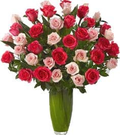REMARKABLE 36 MIX ROSES  ARRANGEMENT - Make your feelings known loud and clear with a fresh bouquet of exquisite long-stem mix roses, an unforgettable gift of sophisticated beauty.