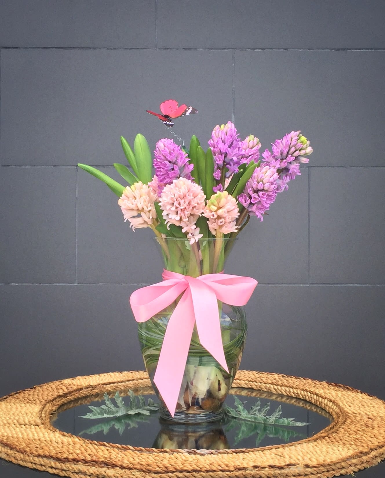 Fragrant Spring - Lovely design including fragrant hyacinths and accents in a glass vase.