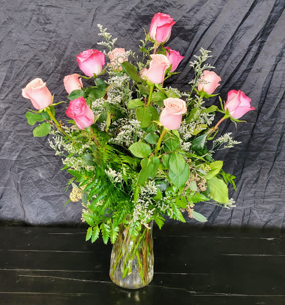 Pink &amp; Purple Roses - This gorgeous dozen roses feature a mix of pink and purple roses with a mix of greens and fillers.