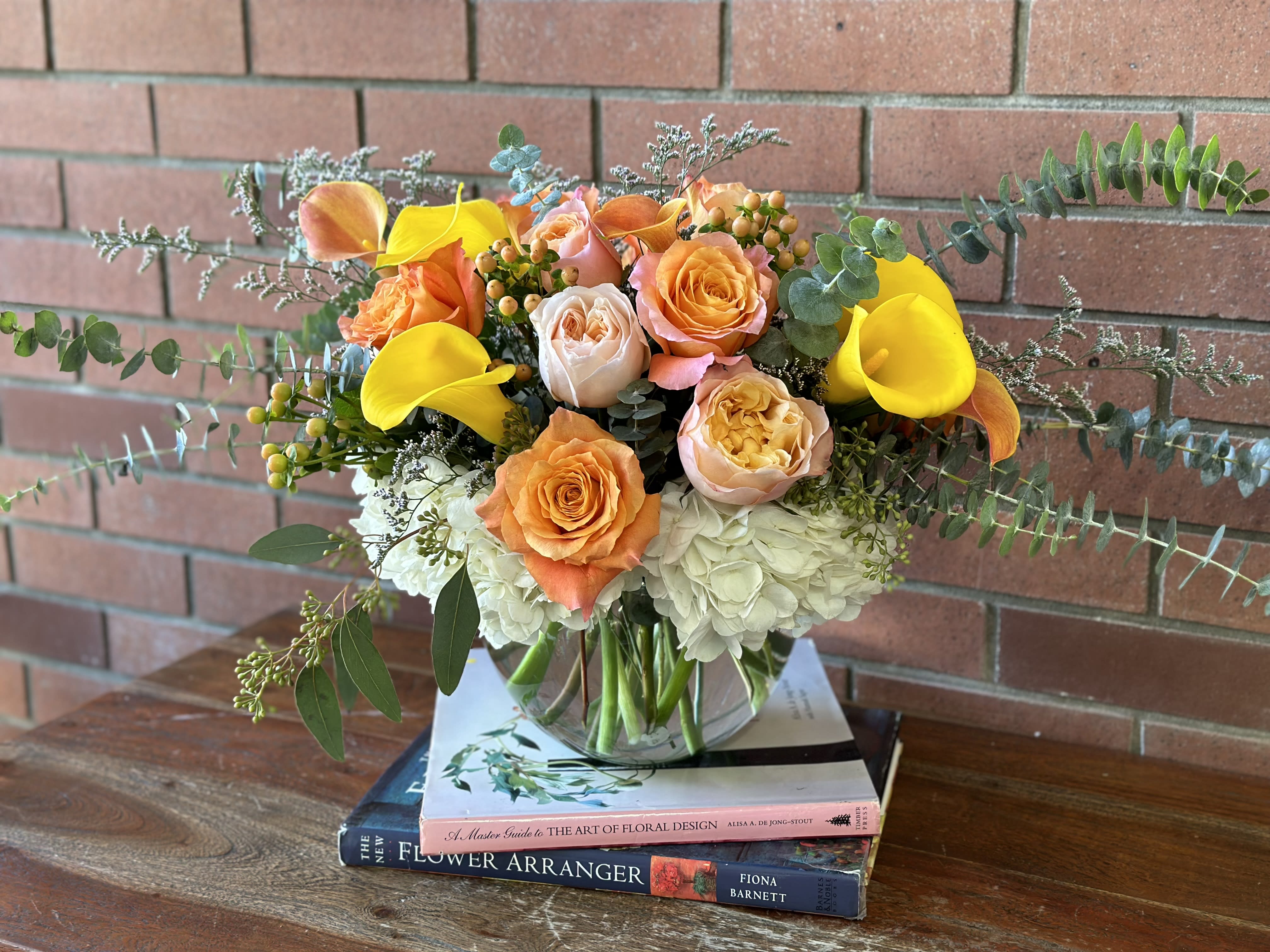 Sunny &amp; Lush Bouquet  - A lush mixture of free spirit garden roses, premium David Austin peach garden roses, white hydrangeas, calla lilies, hypericum berries, eucalyptus and misty blue filler flowers arranged in a large bubble bowl vase. 