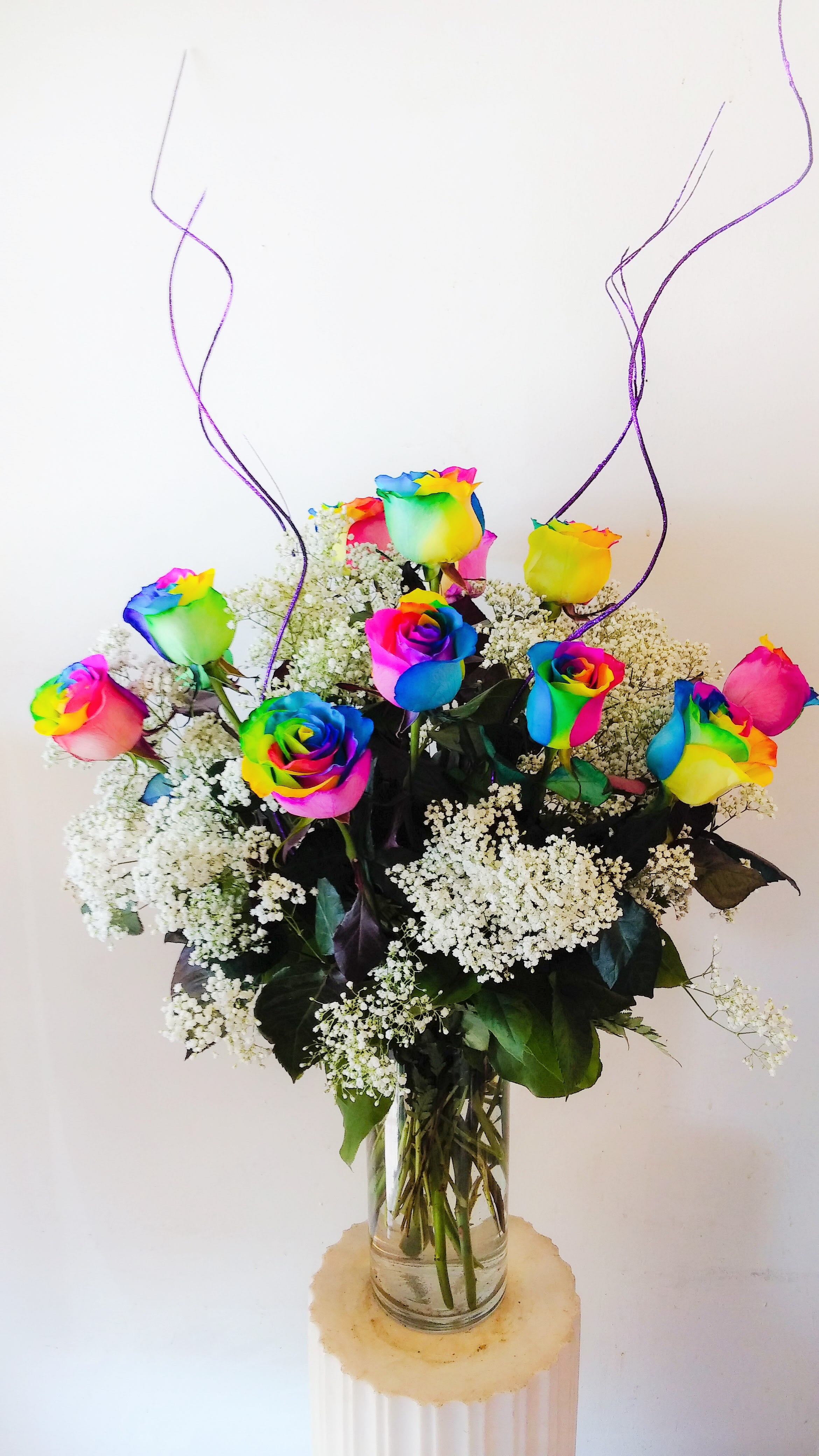 1 dozen Rainbow Roses 1 dozen Rainbow Roses - 1 dozen unique Rainbow roses arranged in a 5" x 12" cylinder vase