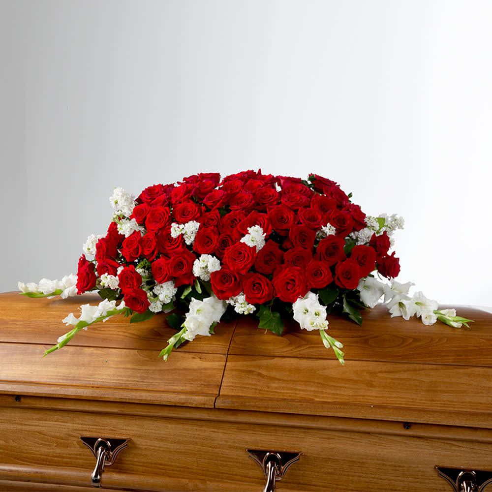 Eternal Love by BloomNation™  - Red roses and white flowers in this full casket symbolize love and purity. A classic style for those to celebrate a life well lived. Need 1-2 days advance notice to order.