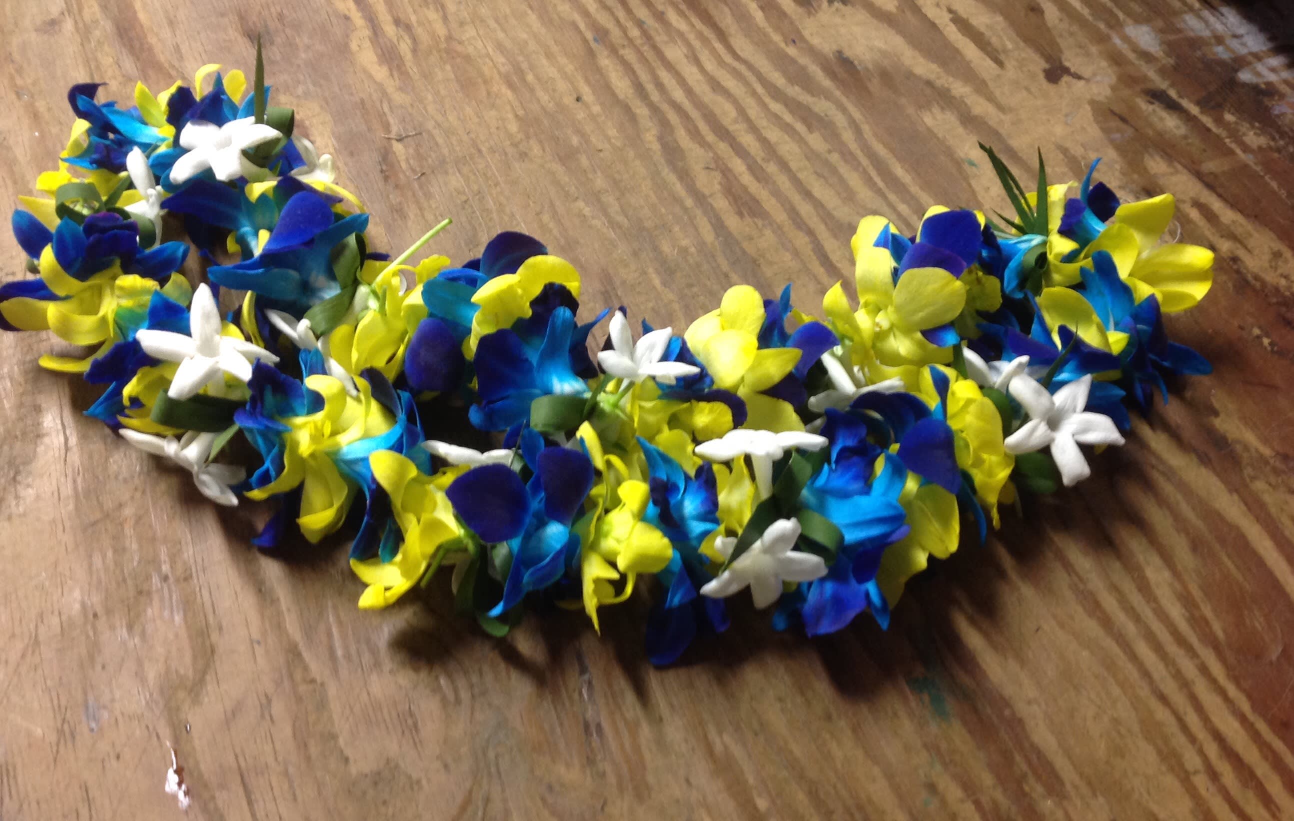 Leis #7 Leis #7 - Our beautiful leis are great for graduations, birthdays, or any celebration! WARNING: DYED ORCHIDS, MIGHT STAIN CLOTHES.