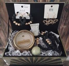 Black &amp; Gold Bling Box  - Baskets are one of a kind, please call to order. 504-341-4305  Basket Contains: Sliver &amp; Gold Mirrored Jewelry Box Bourbon Royalty Candle - Garden District William Morris - Mini Lotion &amp; Bath Bomb Clay Earrings Matching Clay Bracelet Set Gold Fleur De Lis Earrings