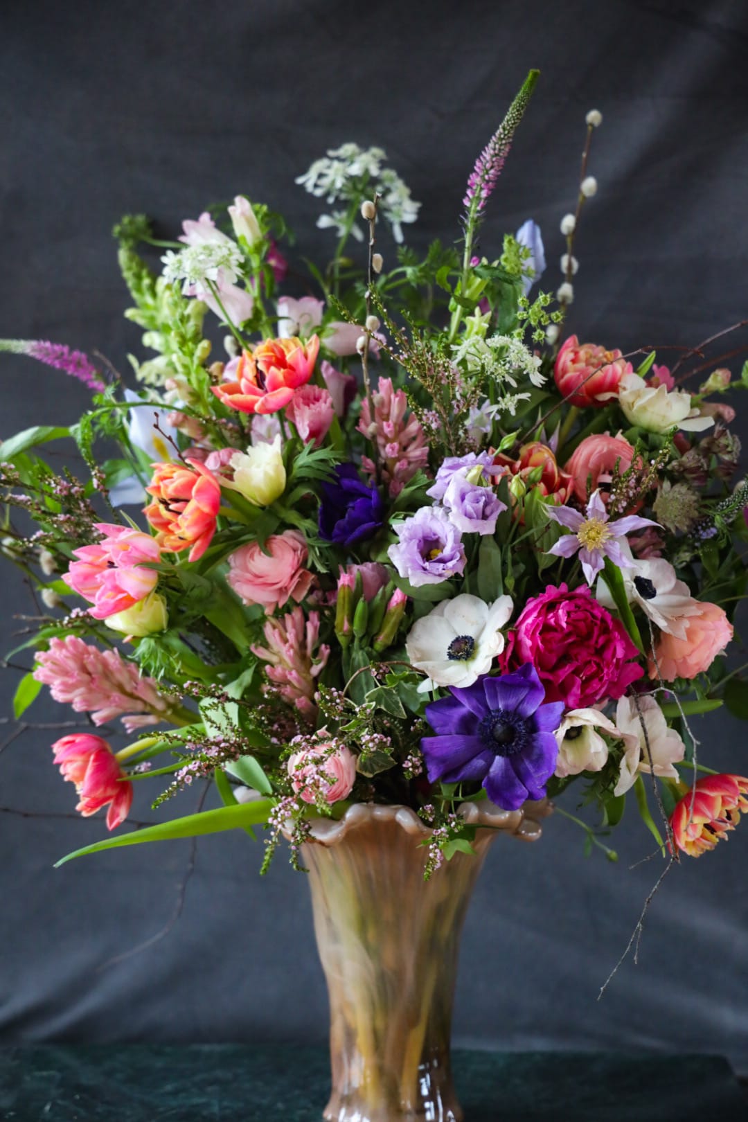 The Promise of Spring Arrangement  - Floral poetry ode to Spring. Embodying the unfurling Nature of the budding season. Fragrant &amp; richly inspired.    Custom, one of a kind floral arrangements by floral artist Stacy Leafsong.  Photos provide examples, and each arrangement &amp; vase is unique.   Arrangements will be delivered before 7pm, for specific delivery time please include in special instructions. On holidays, our busiest times, deliveries will be made by 7:30pm.
