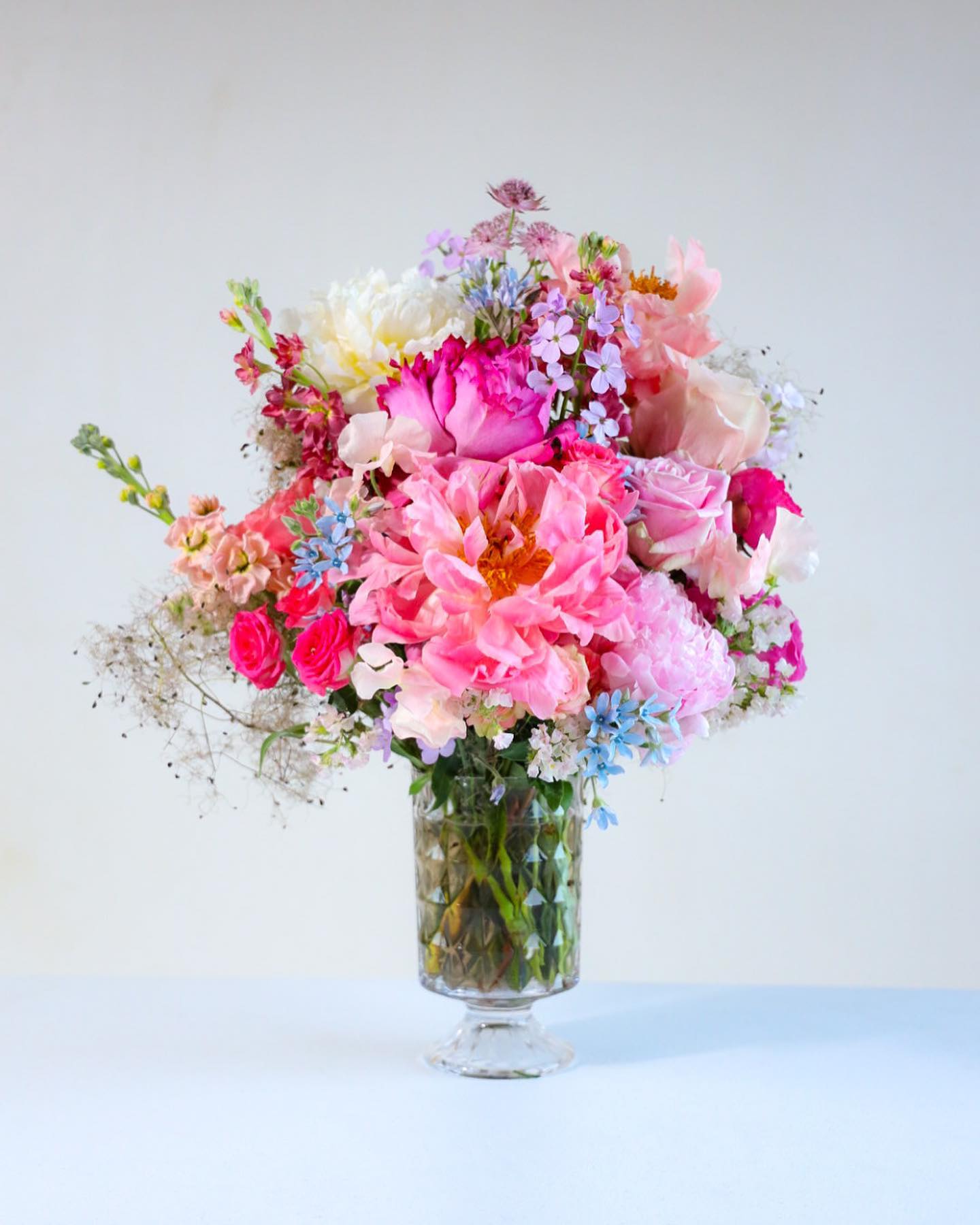 The Sweet Summer Arrangement - The Sweet Summer Arrangement captures the preciousness of the peak season, full of grace, sweet scents, like a warm embrace. Share some floral sweetness with those both near and dear to your heart.   Custom, one of a kind floral arrangements by floral artist Stacy Leafsong.  Photos provide examples, and each arrangement &amp; vase is unique.  Arrangements will be delivered before 7pm, for specific delivery time please include in special instructions. On holidays, our busiest times, deliveries will be made by 7:30pm.