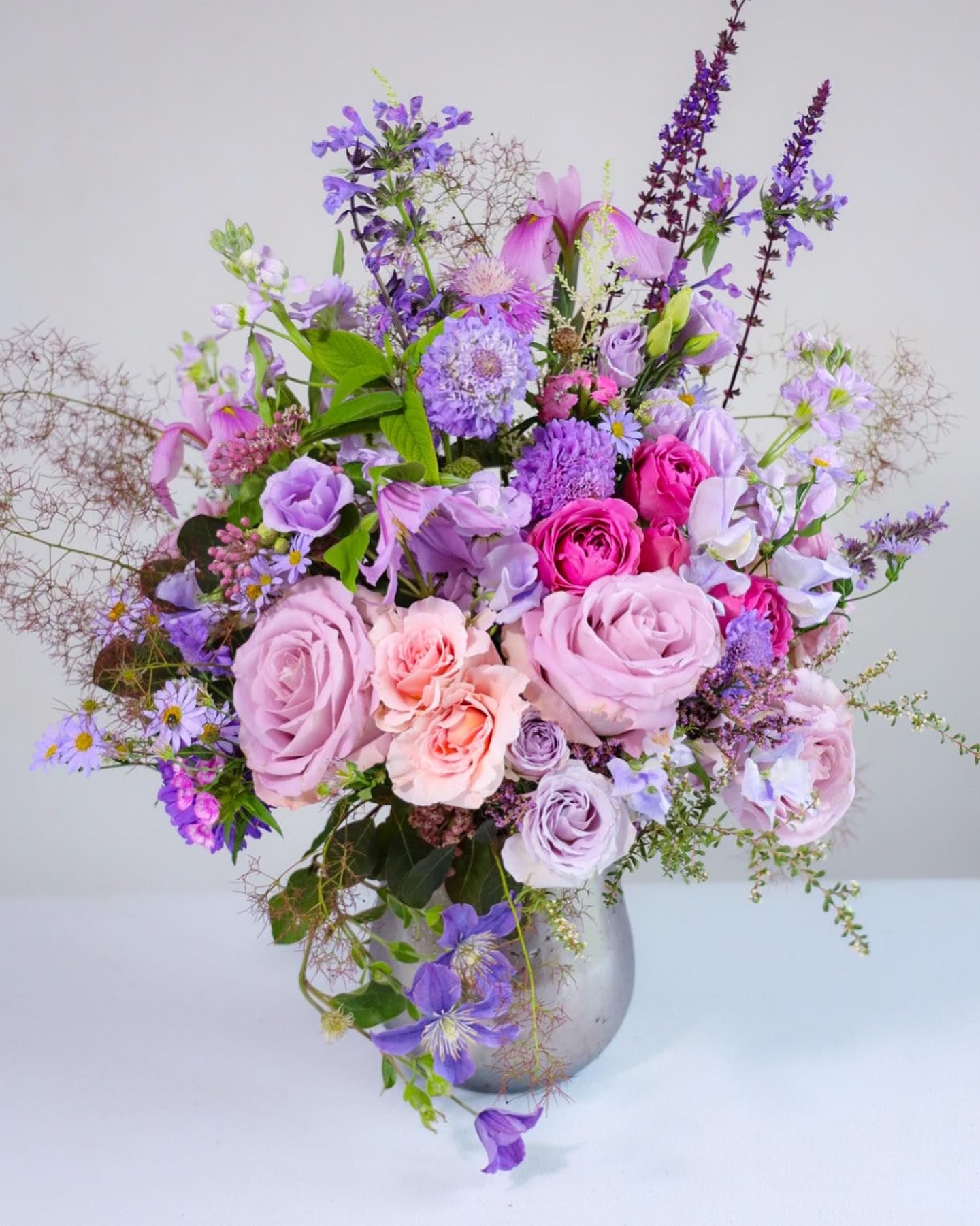 The Lavender Lady Arrangement - The Lavender Lady Arrangement. Lavender was my grandmother’s favorite color. She filled rooms with the violet hue, in just the right measure. Bring this inspired arrangement, created with artisan flair to your favorite purple and all shades of amethyst, violet    Custom, one of a kind floral arrangements by floral artist Stacy Leafsong.  Photos provide examples, and each arrangement &amp; vase is unique.  Arrangements will be delivered before 7pm, for specific delivery time please include in special instructions. On holidays, our busiest times, deliveries will be made by 7:30pm.