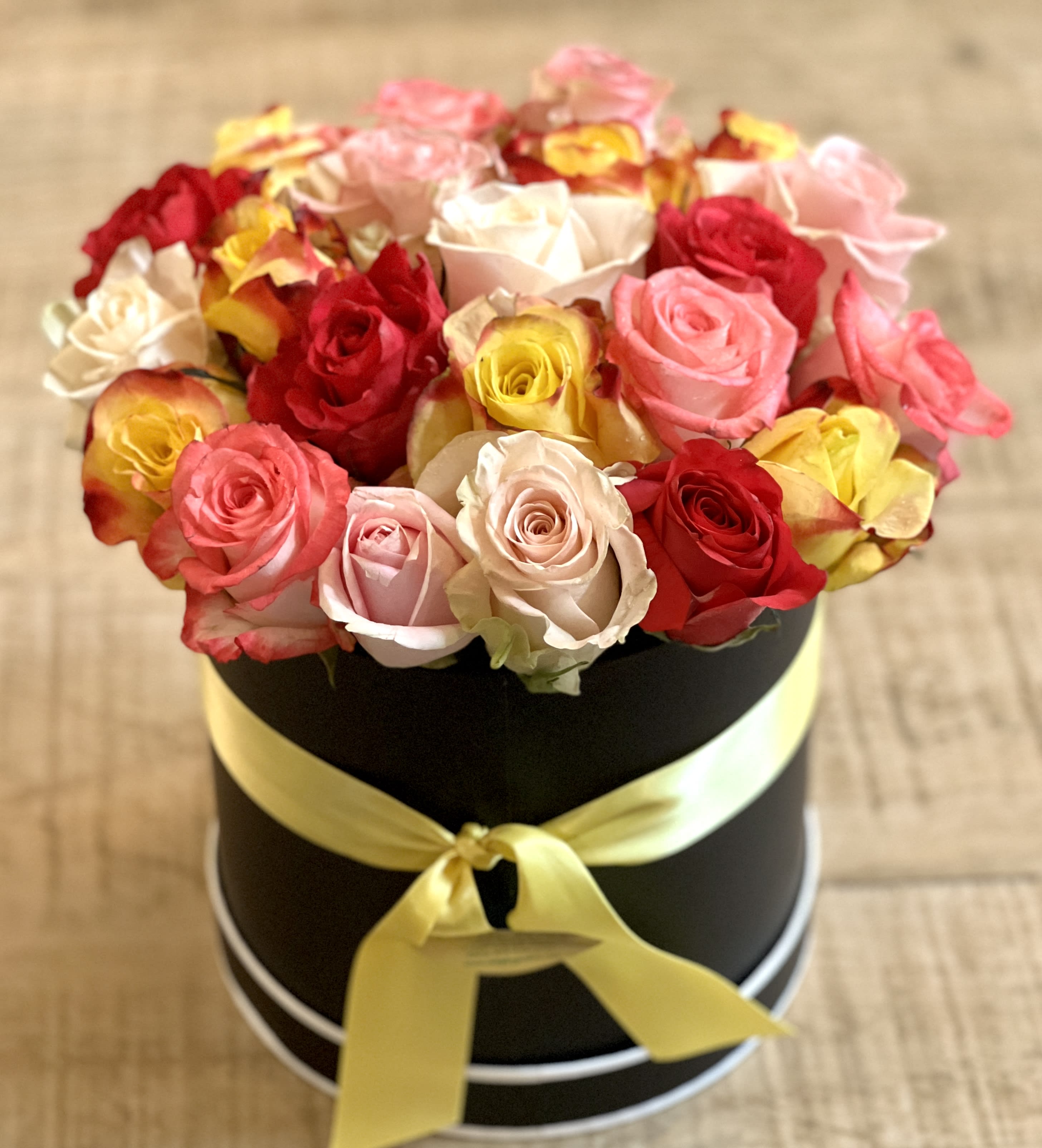Deluxe Mixed Color Rose Hatbox - This gorgeous deluxe hatbox full of 24 beautiful mixed color roses makes a perfect gift for any occasion!