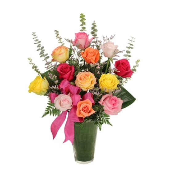 Radiant Roses - Send Mom's Radiant Rose bouquet, a rainbow of roses with special touches of  baby blue euclayptus, aspidistra leaves, limonoium and hot pink bow.. A gift that's sure to make her smile.
