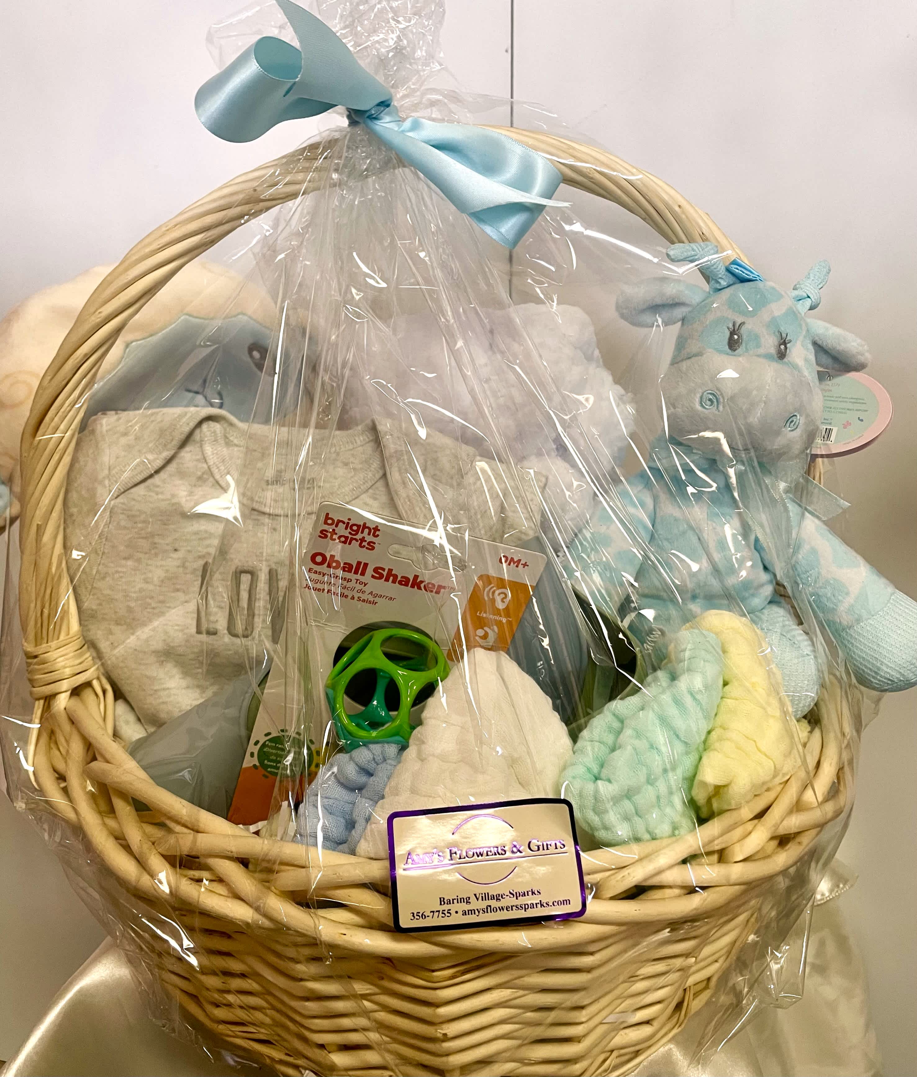 Baby Boy Welcome Nursery Basket Baby Boy Welcome Nursery Basket - Large, useful baby boy nursery basket. Has a cuddle puff, cute giraffe, baby nail kit, silicone bibs, baby rattle, sherpa baby throw, soft / gentle cotton wash cloths, and cute onesies! Great gift for the new parents and baby!