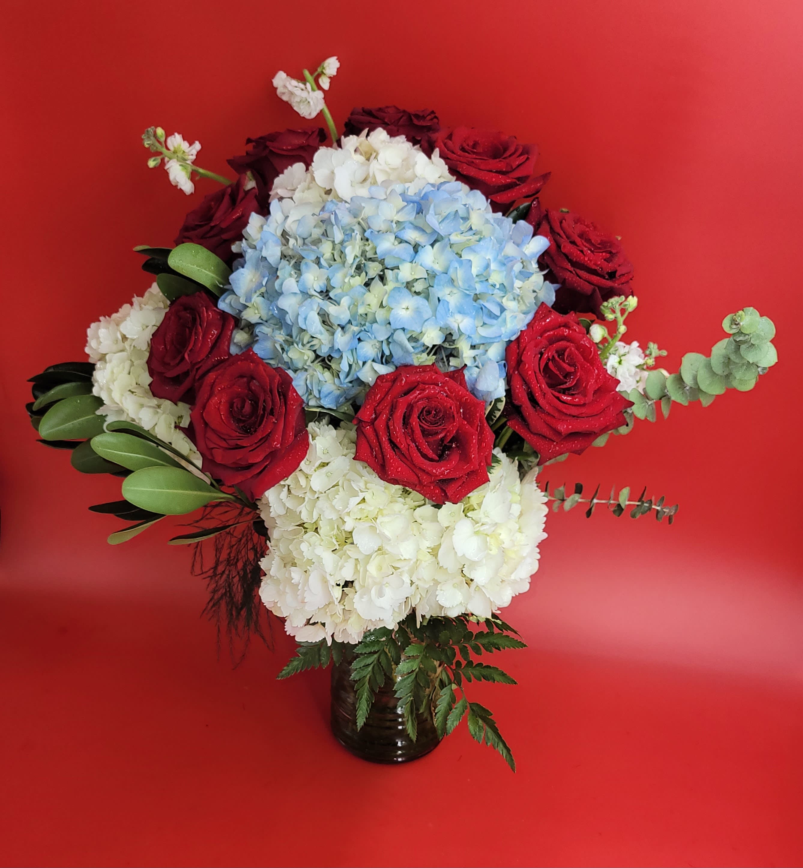 A touch of blue - She is different!  Hydrangeas and roses