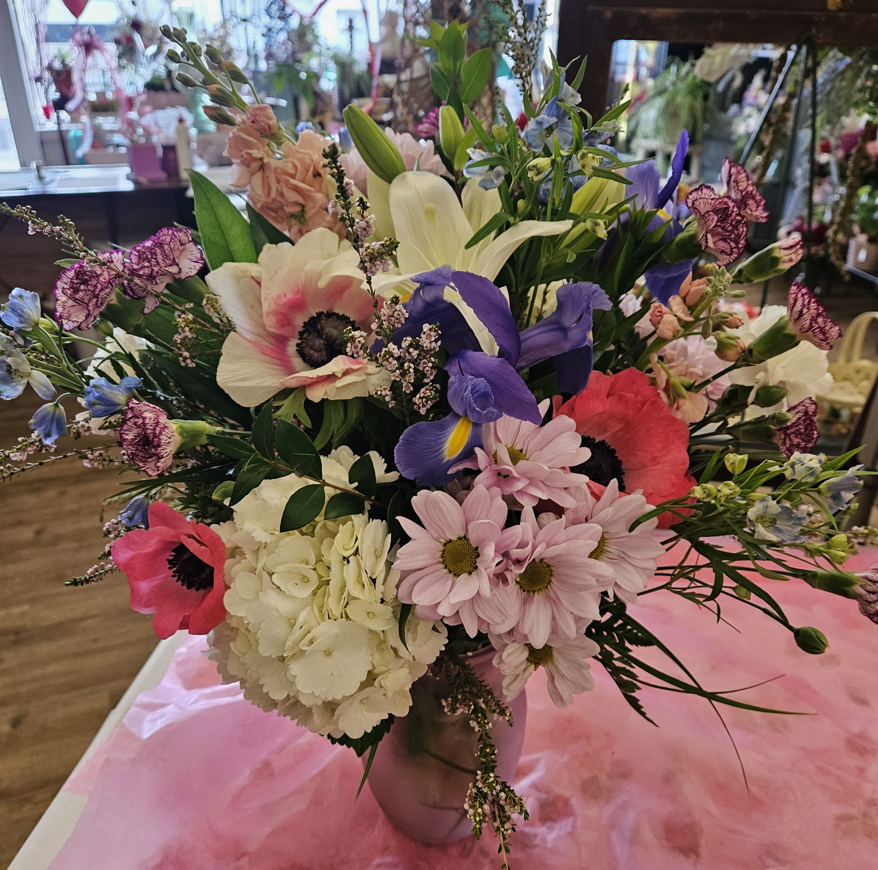 The Towanda - Wild and carefree assortment of spring blooms in a vase. 