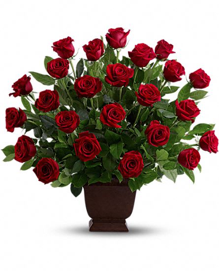  Rose Tribute   T224-1A  - An elegant expression of sympathy and love, this eye-catching arrangement presents two dozen red roses in a classic garden urn. This item is hand-arranged and delivered by our florist. All prices in U.S. Dollars. 