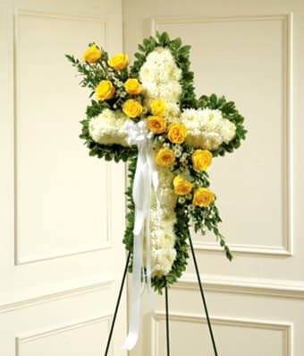 Yellow &amp; White Standing Cross With Yellow Rose Break - Send a beautiful floral tribute that expresses all the love and sympathy you feel during this difficult time. • This standing spray arrangement - in the shape of a cross - is created from fresh yellow and white flowers such as roses, football mums and more. • Traditionally sent directly to the funeral home by family members or friends and displayed on a stand.  • Due to the urgency of the occasion, our florists use only the freshest flowers available, so varieties and colors may vary.  • Measures approximately 42&quot;H x 28&quot;L without easel.