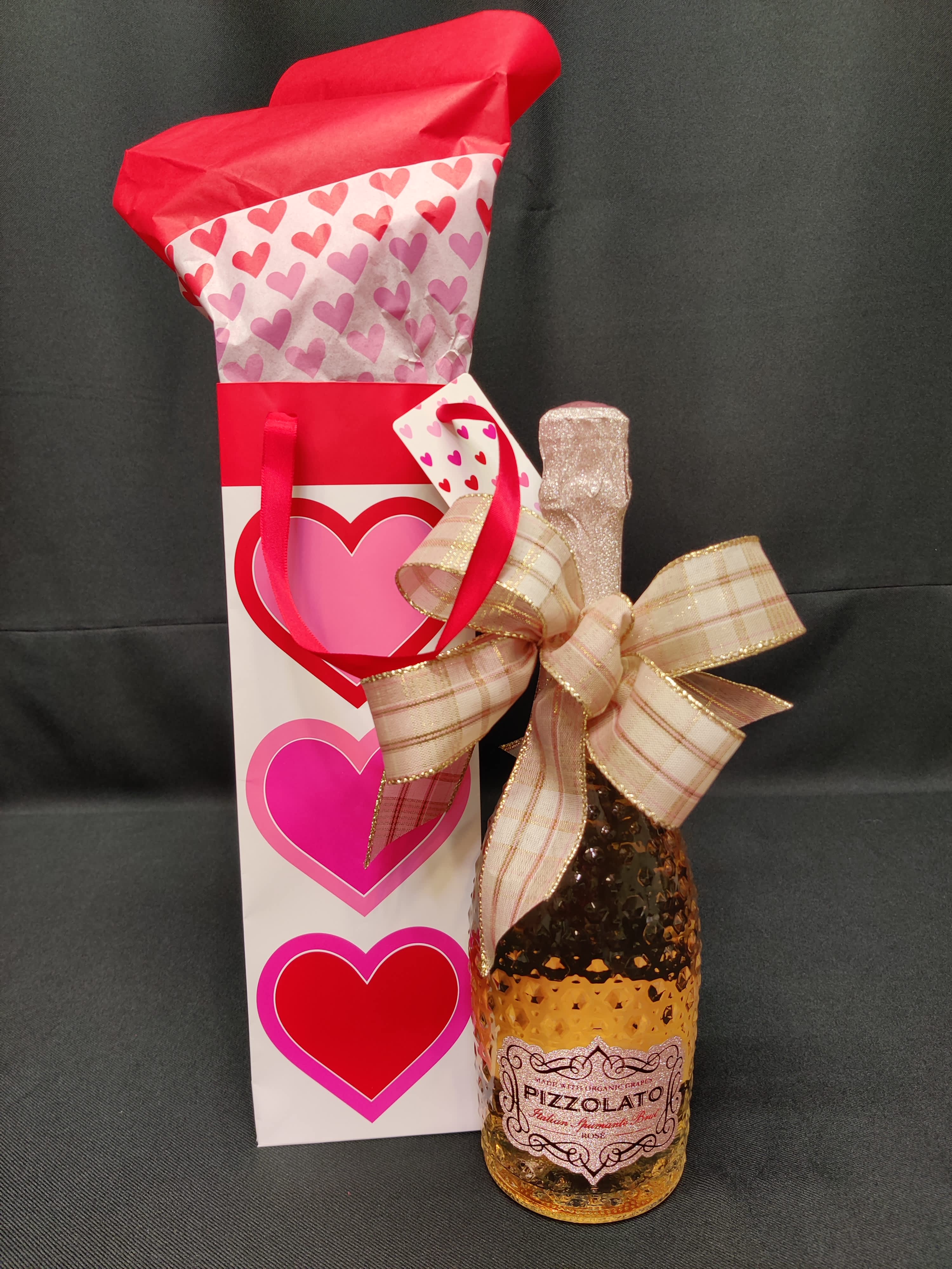 Italian Spumante Brut Rose,   Organic Grapes - We know this as champagne. It is a sparkly pink and perfect for Valentine's day.  Owner Geri's favorite! I highly recommend this to start off your Valentine weekend.   Full size bottle, gift wrapped too.