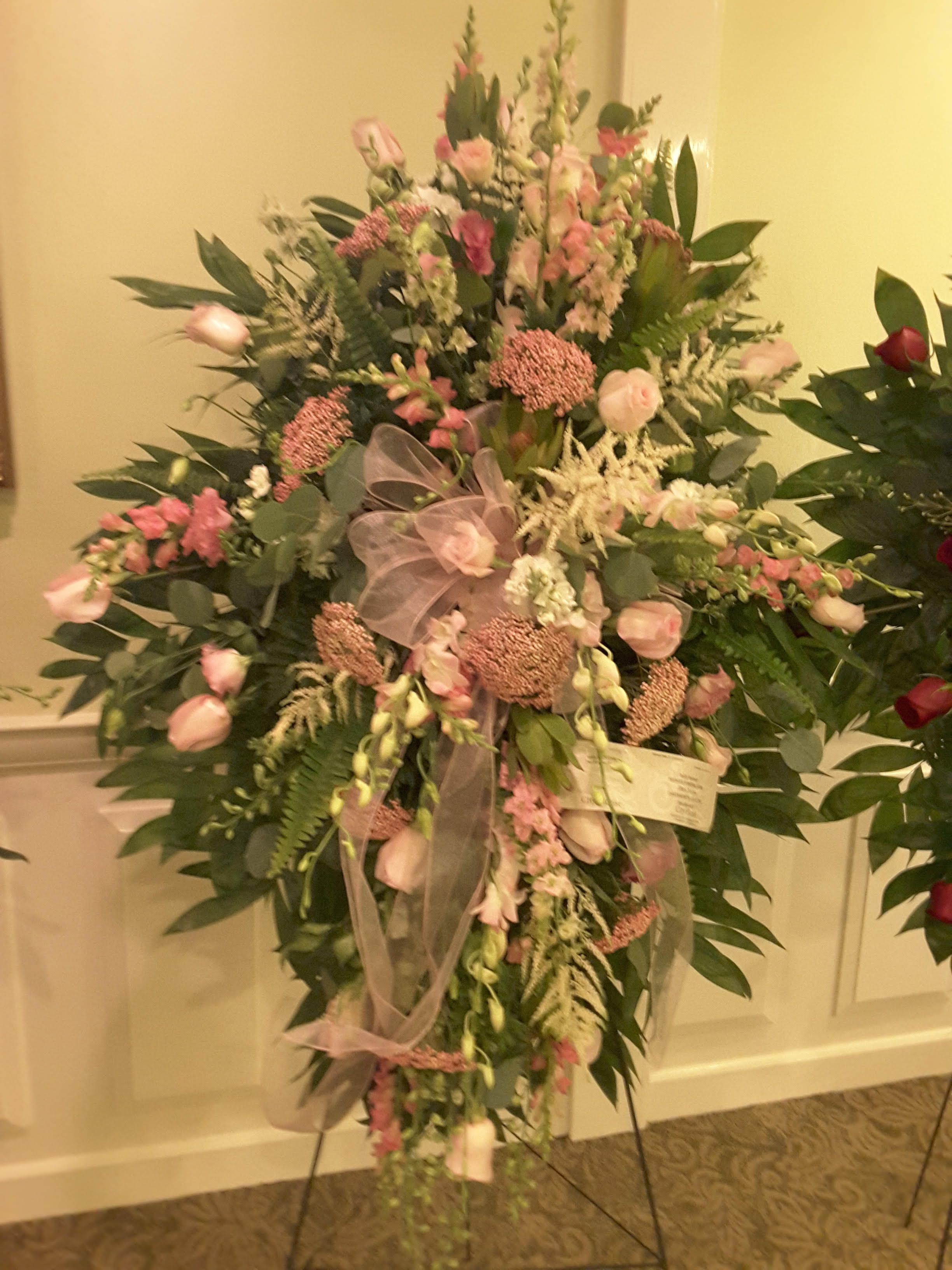Pink Standing Spray - Seasonal pink flowers.   Premium Pictured