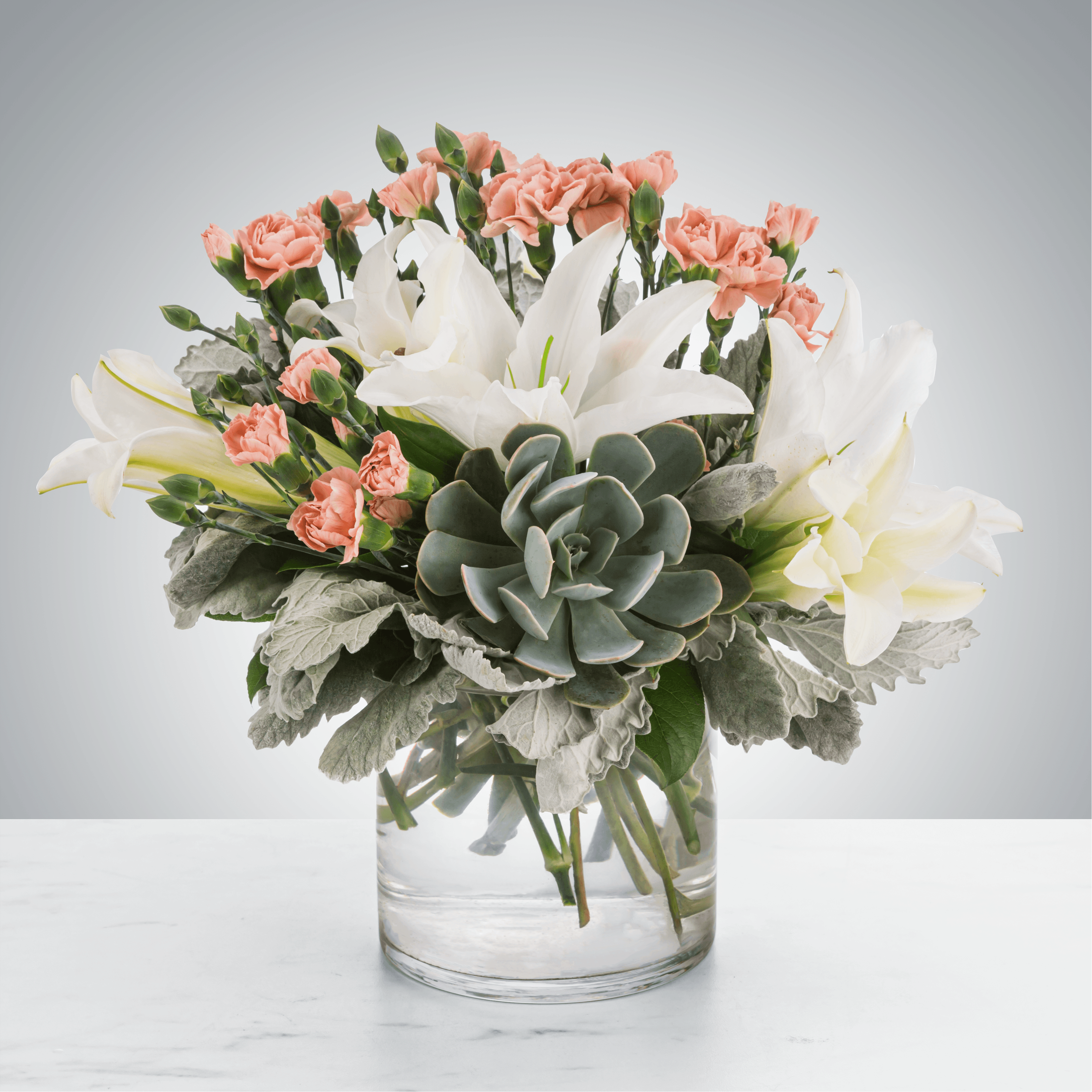 Poise by BloomNation™ - A lovely succulent arrangement featuring blush and white flowers, Poise by BloomNation™ makes a great gift for almost any occasion like Best Friends Day or Sister's Day.  Approximate Dimensions: 12&quot;D x 12&quot;H
